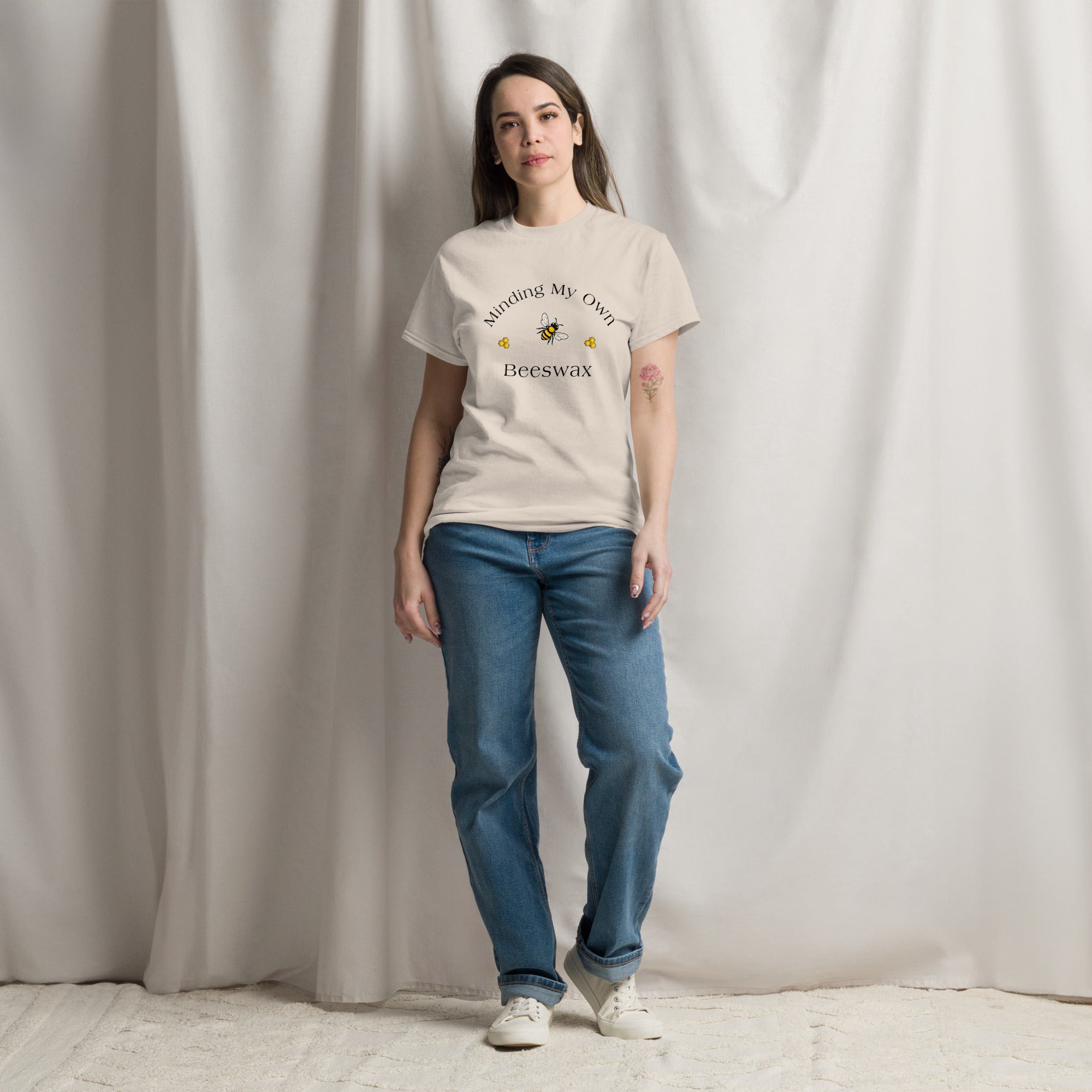 Light tan unisex T-shirt with round neck and bee graphic with text on chest.