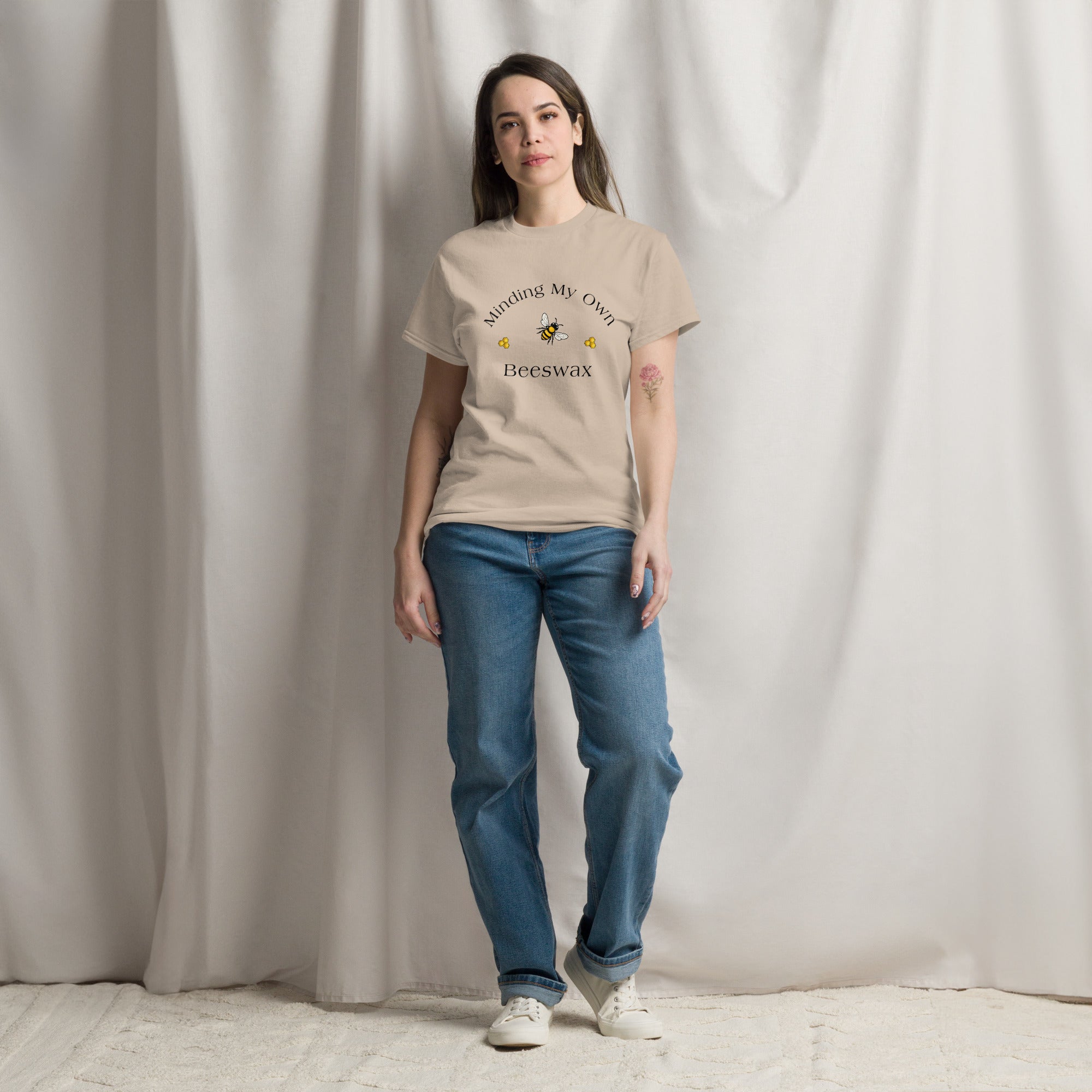 Tan unisex T-shirt with round neck and bee graphic with text on chest.