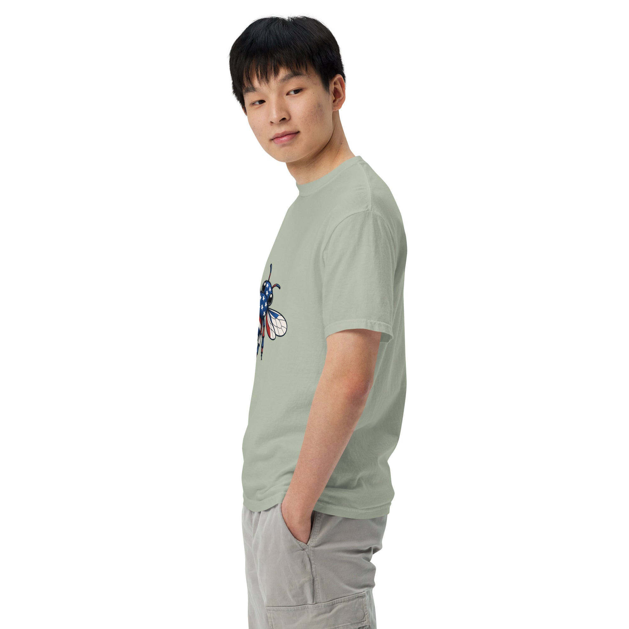 Unisex heavyweight T-shirt, sage green side view with blue-red bee graphic