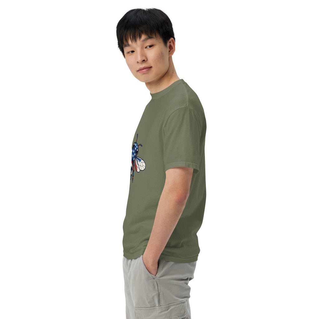 Unisex heavyweight T-shirt, sage green side view with blue-red bee graphic