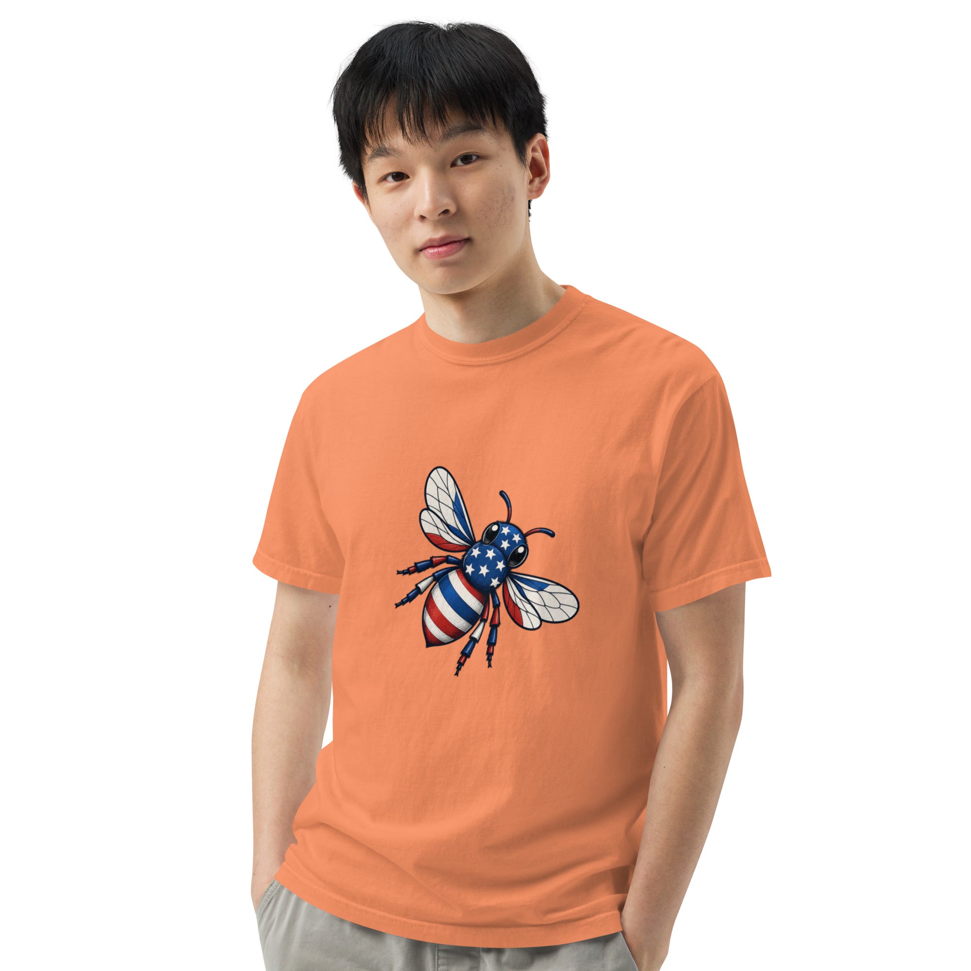 Orange heavyweight unisex crew-neck T-shirt with colorful bee graphic on chest.