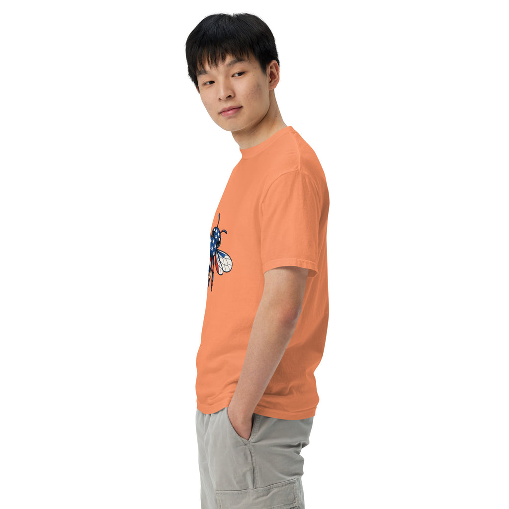 Unisex heavyweight T-shirt, orange side view with blue-red bee graphic