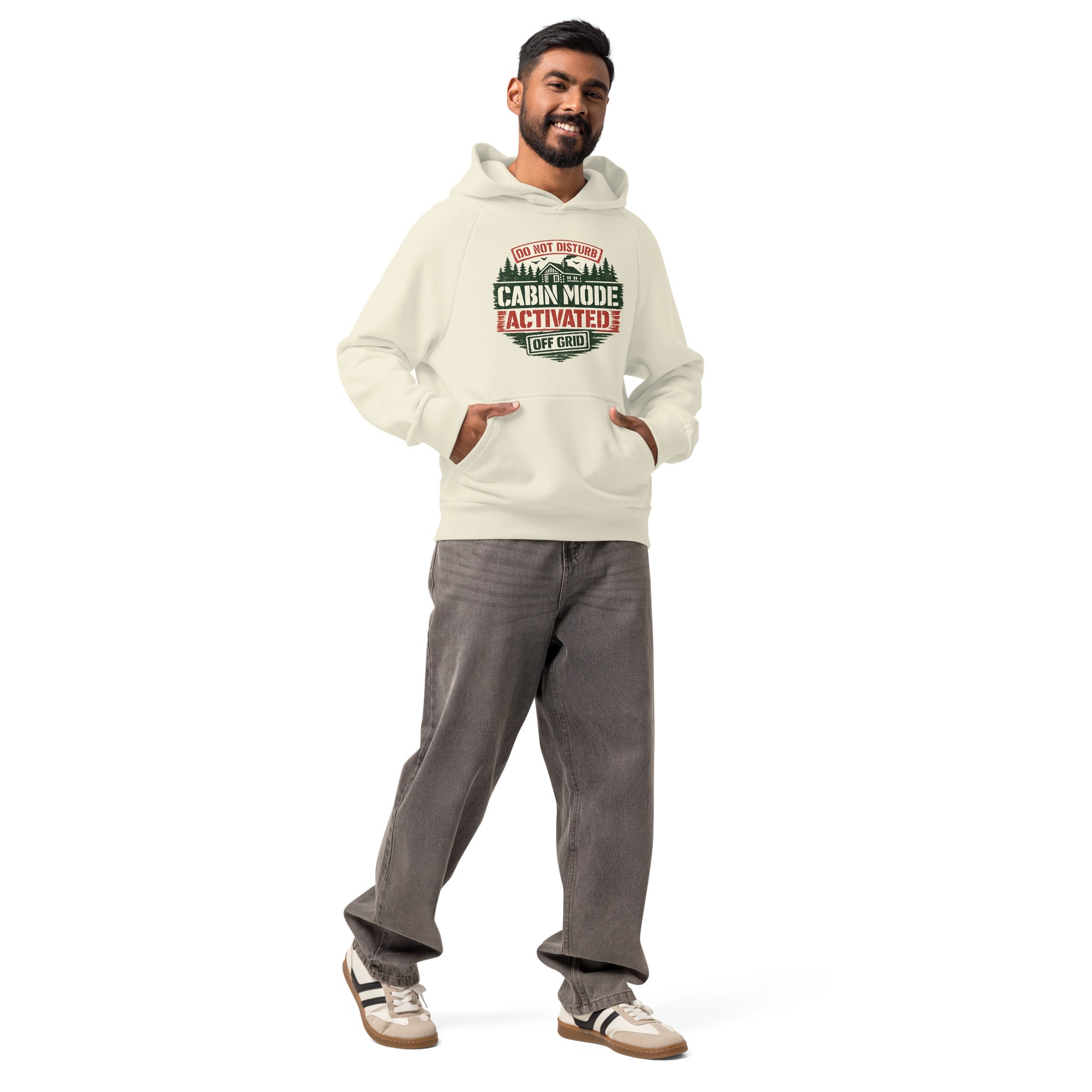 Unisex heavyweight hoodie in cream-sage green with hood and kangaroo pocket, front graphic