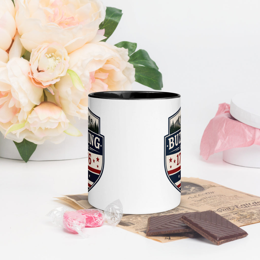 Color-inside ceramic mug with printed shield; black interior rim.