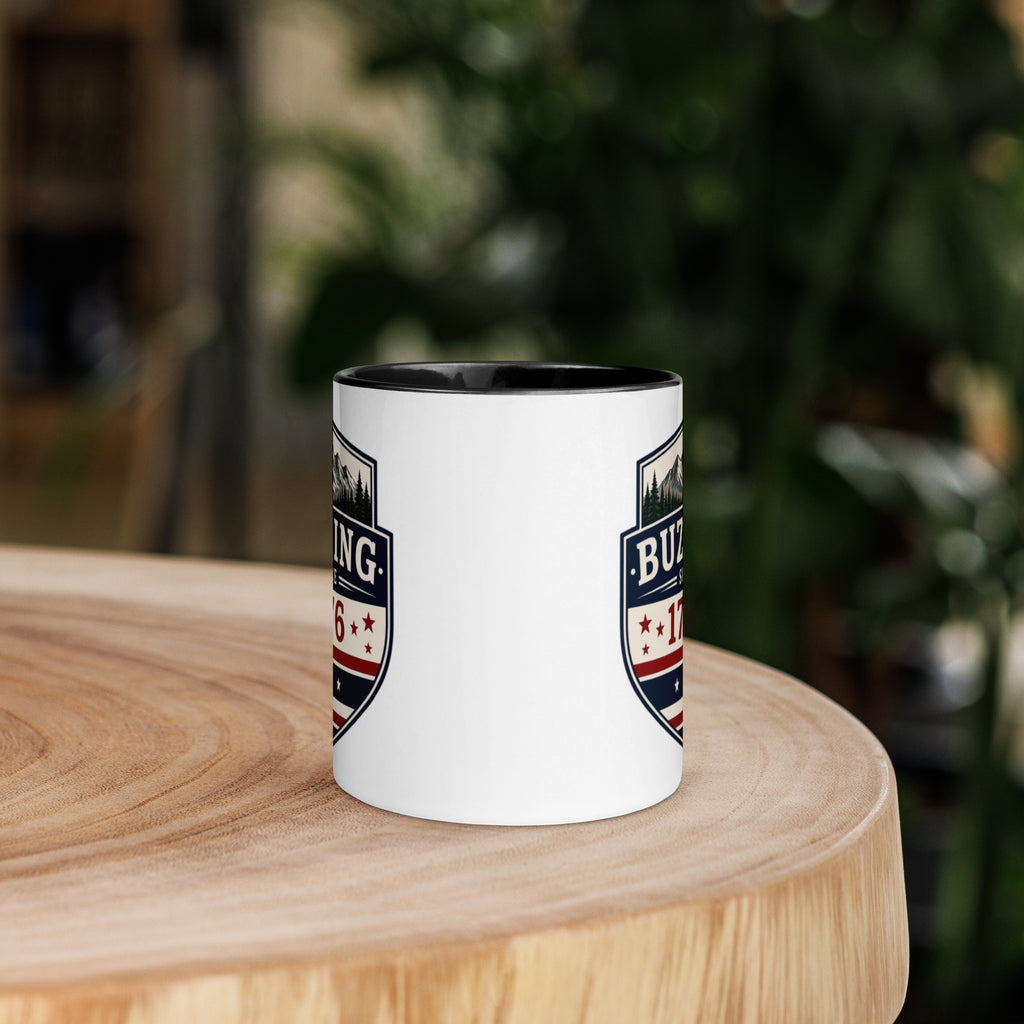 White coffee mug with black interior and blue-red emblem print on sides
