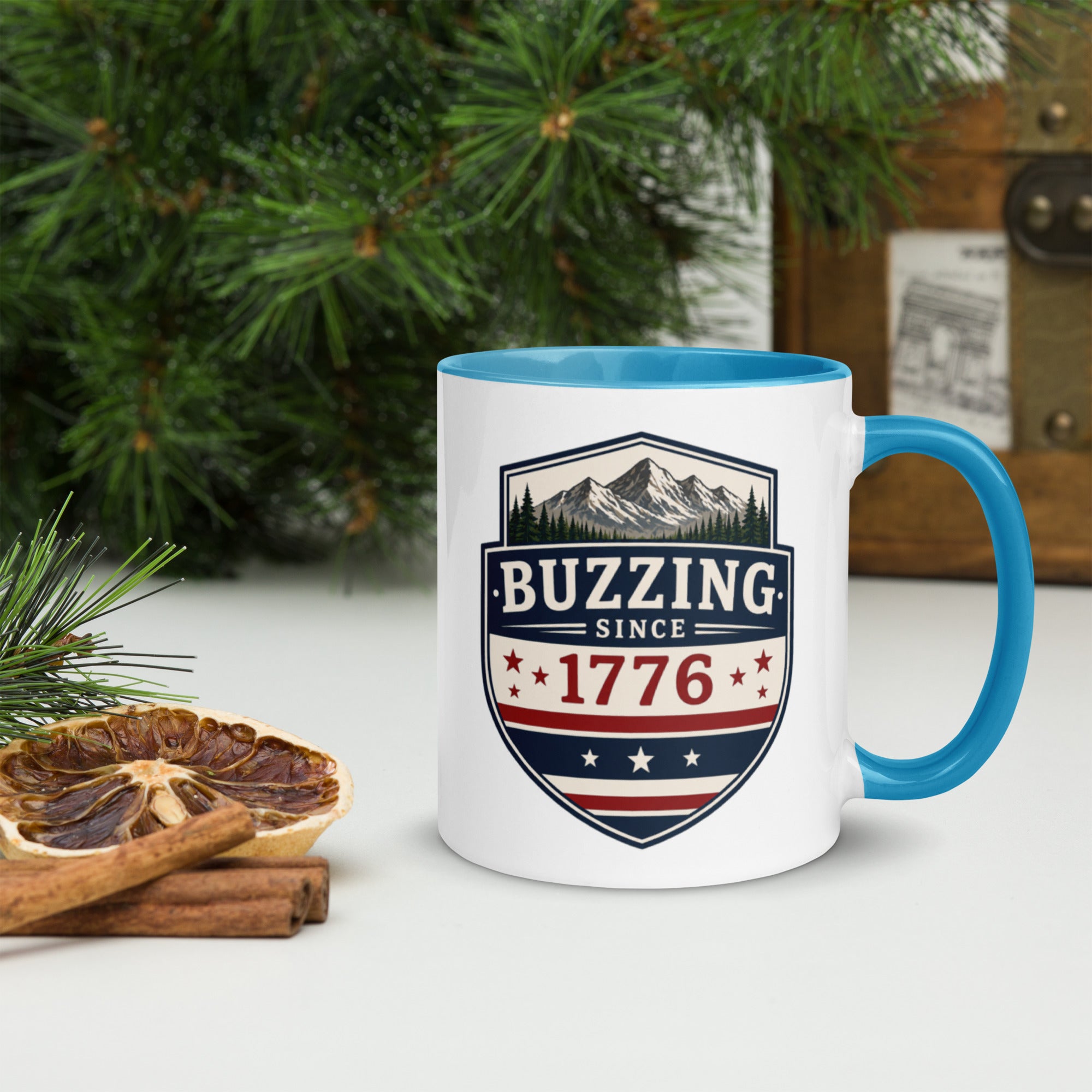 Ceramic mug with white body, blue interior and handle, BUZZING Since 1776 badge
