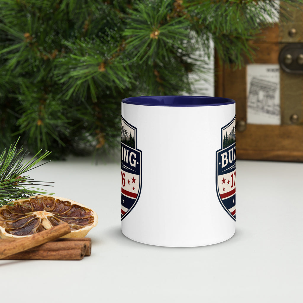 White ceramic mug with printed badge design and dark blue interior rim