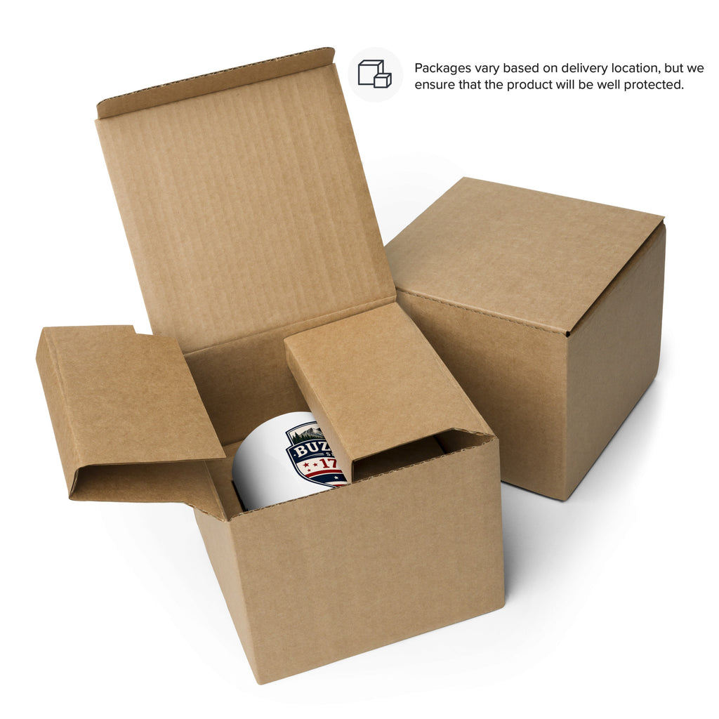Mug with printed emblem logo inside open cardboard packaging