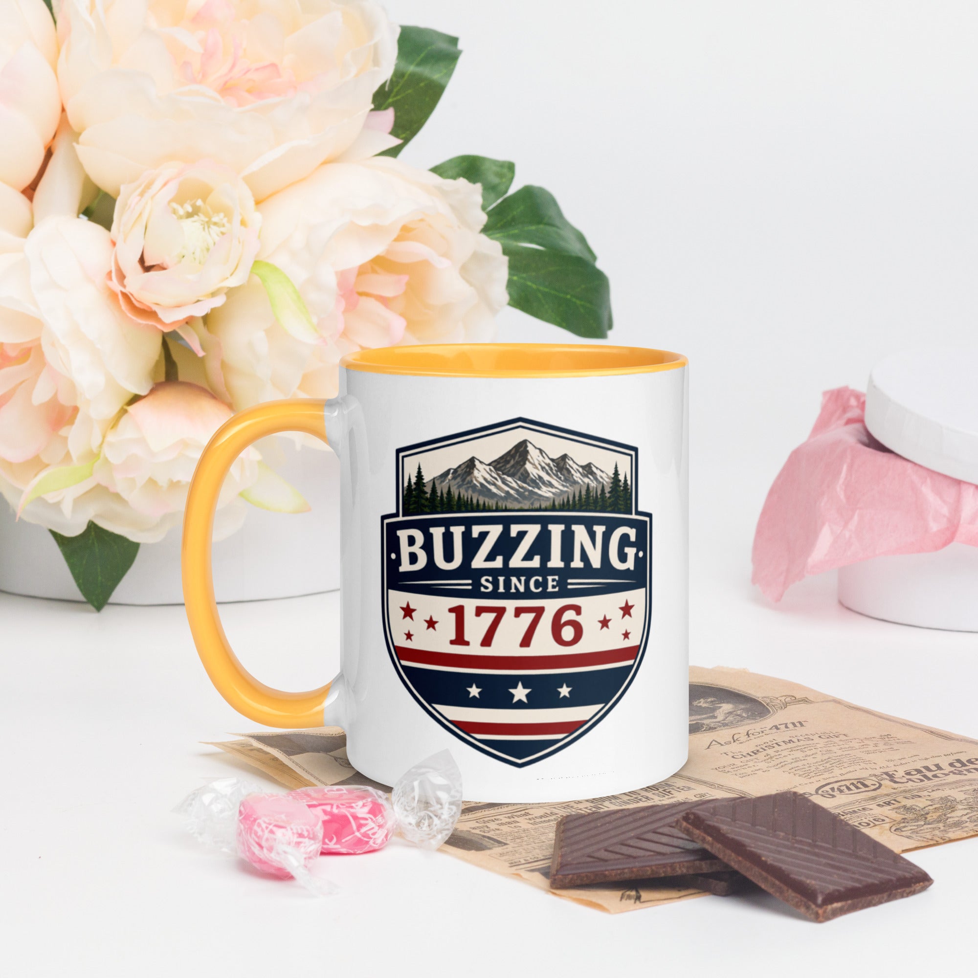 Ceramic mug with patriotic shield print, golden yellow rim and handle