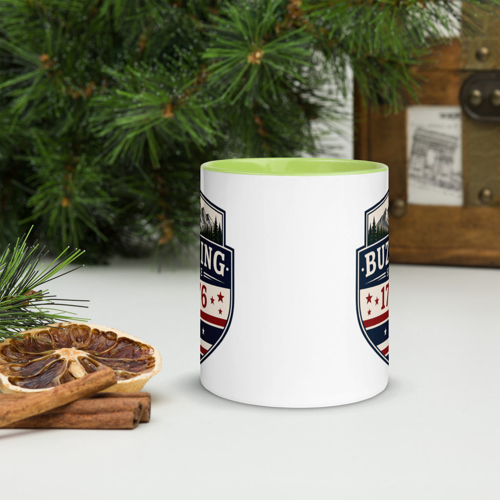 White ceramic mug with printed badge design and yellow-green interior rim