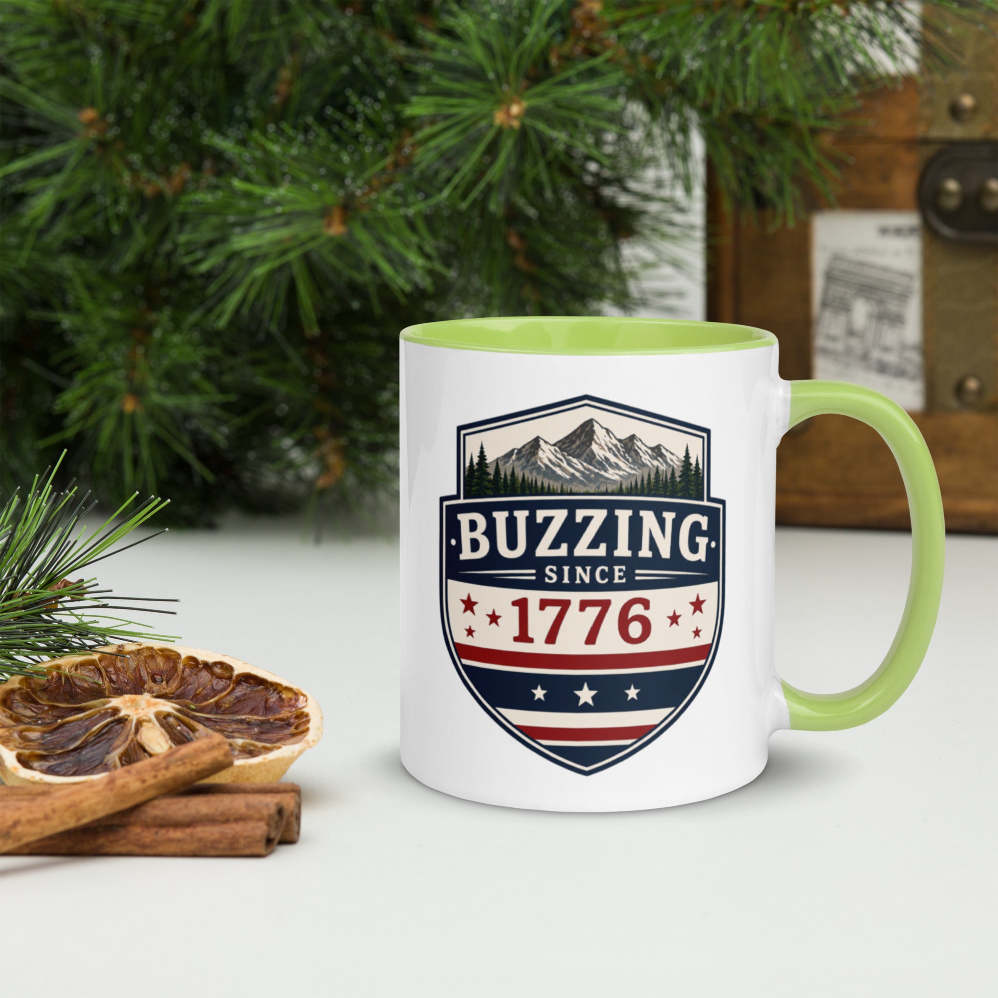 Ceramic mug with white body, light green interior and handle, BUZZING Since 1776 badge