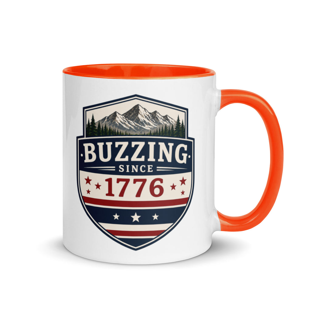 Coffee mug with orange interior and handle; “Buzzing Since 1776” graphic