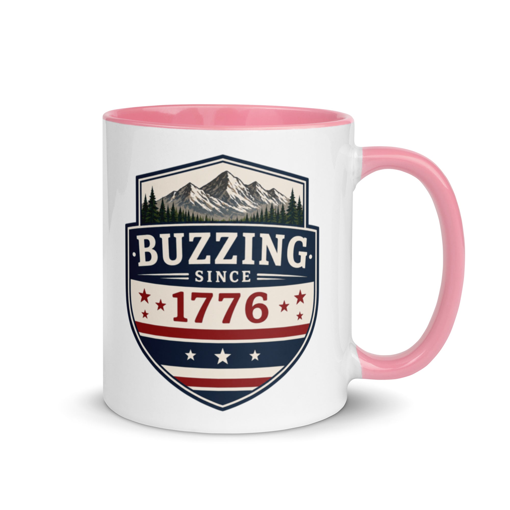 Coffee mug with pink interior and handle; “Buzzing Since 1776” graphic