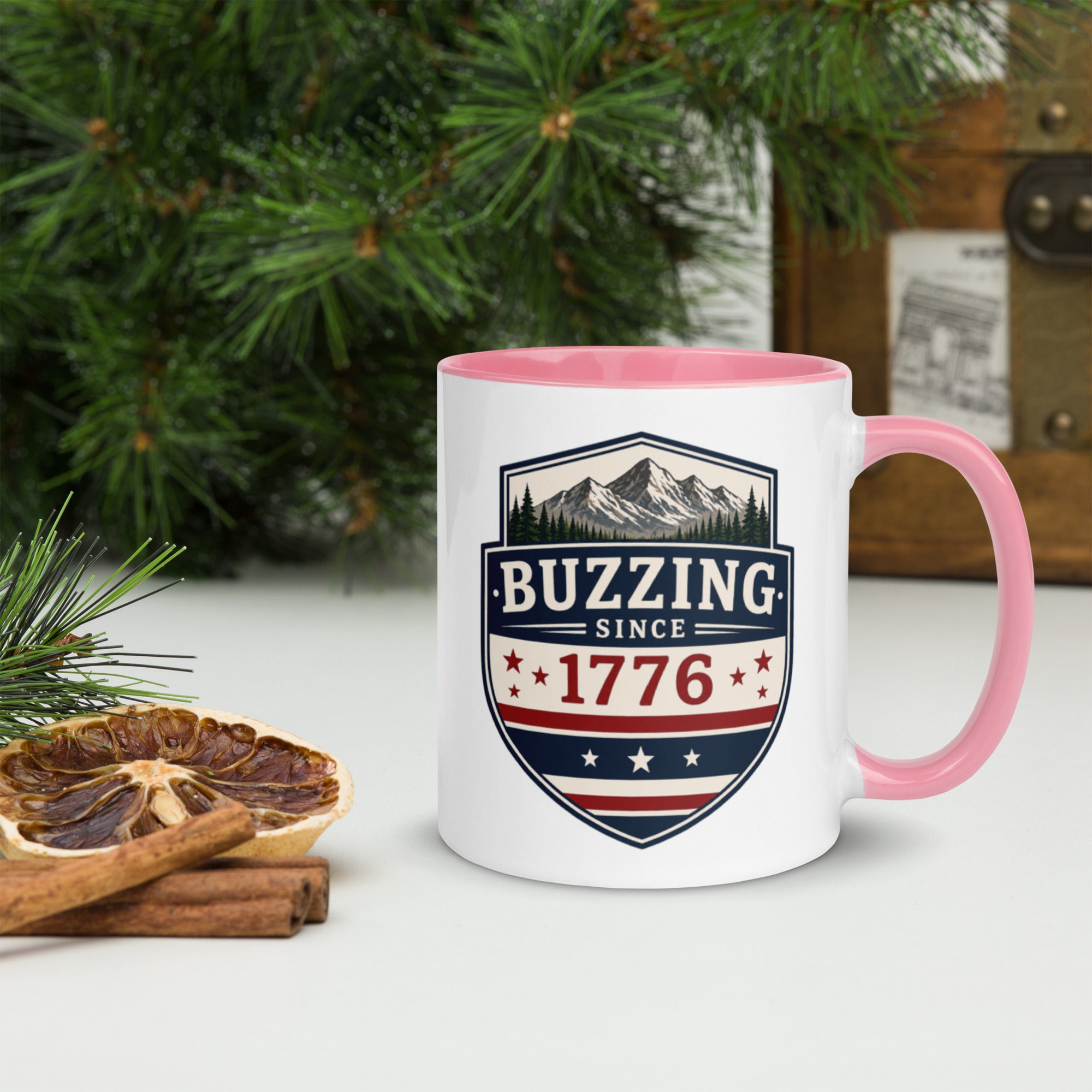 Ceramic mug with white body, pink interior and handle, BUZZING Since 1776 badge