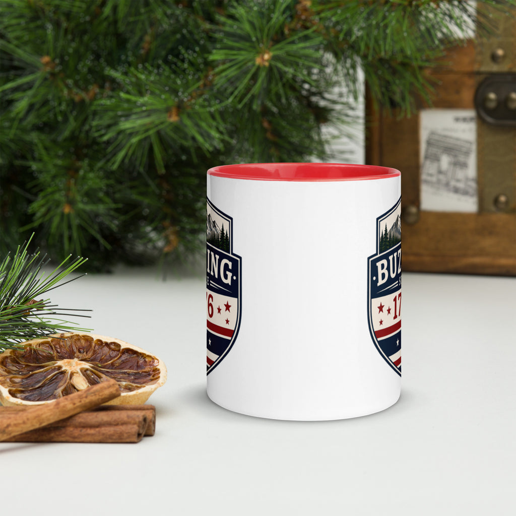 White ceramic mug with printed badge design and red interior rim