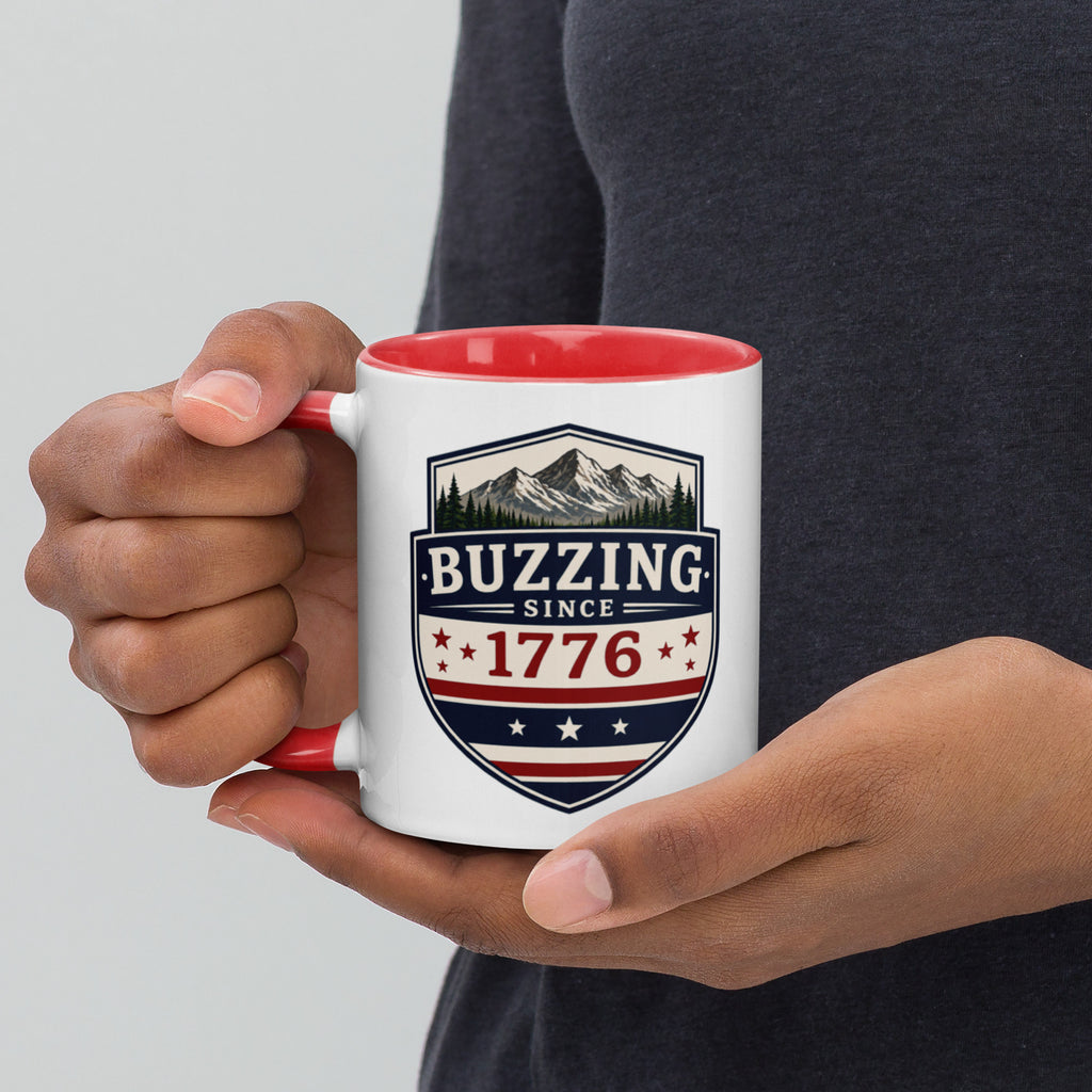 White ceramic mug with red interior, “Buzzing” 1776 crest graphic