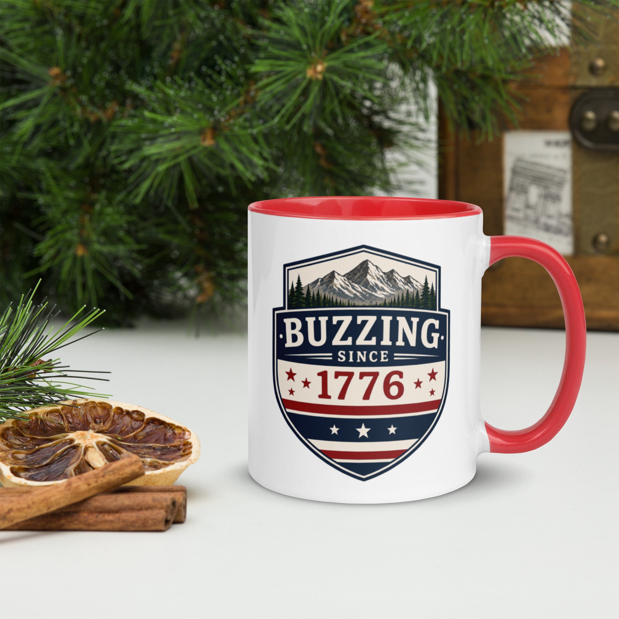 Ceramic mug with white body, red interior and handle, BUZZING Since 1776 badge