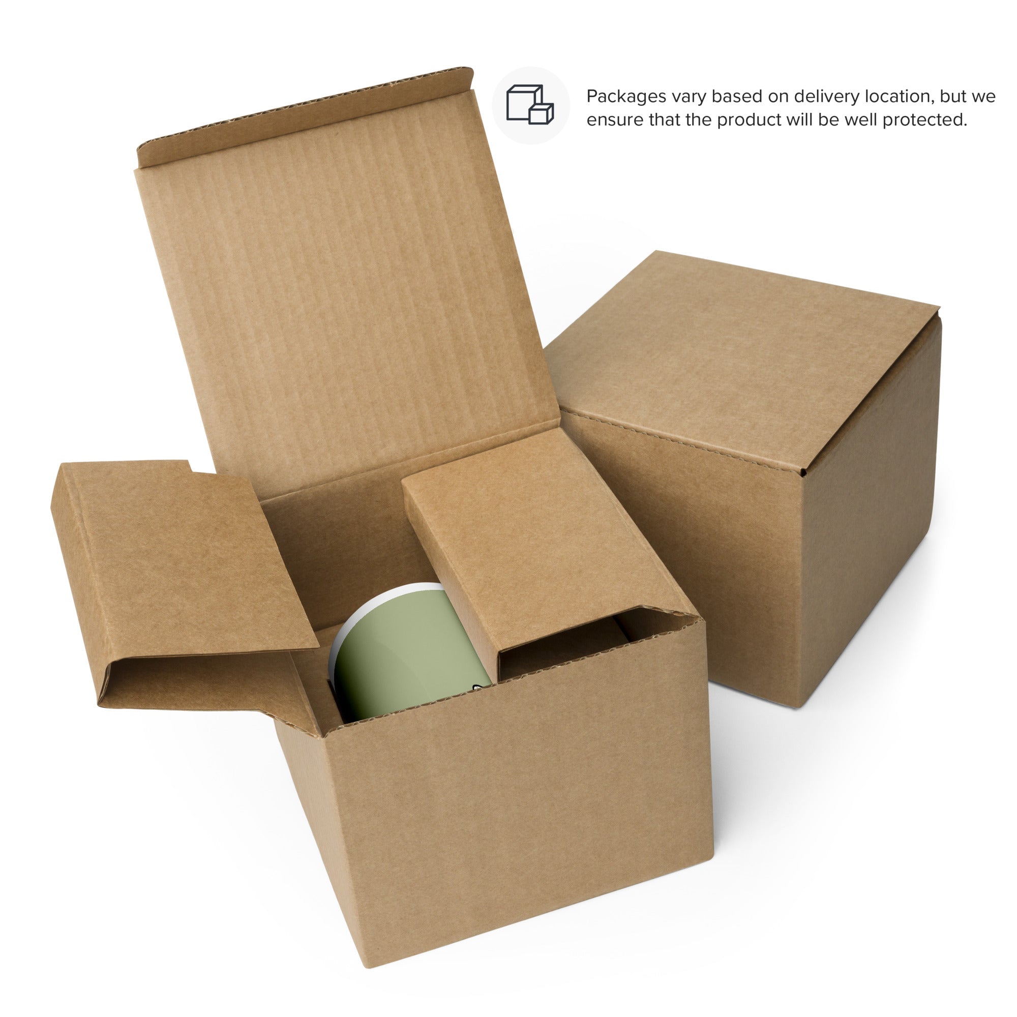 Open cardboard shipping box with a sage green ceramic mug inside