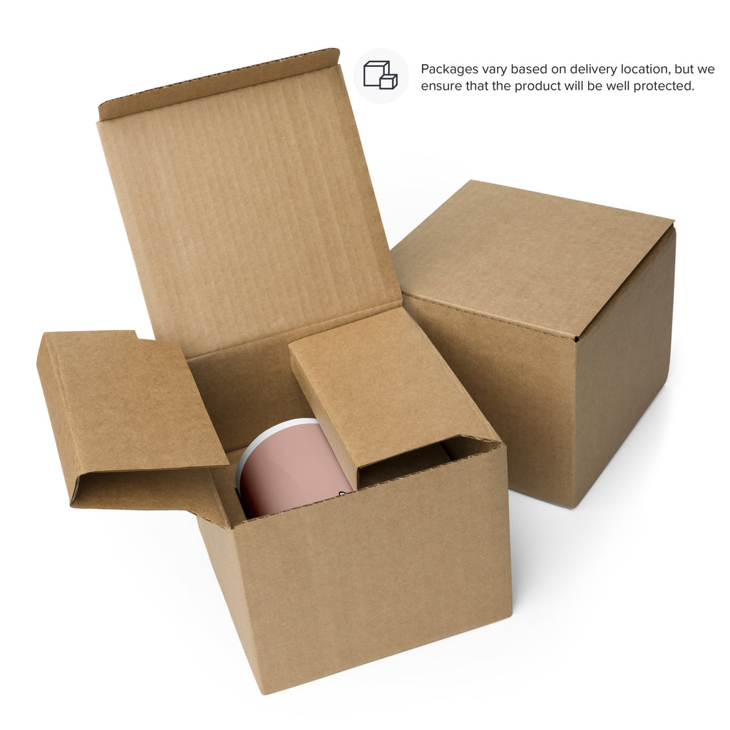 Cardboard shipping box set with molded insert holding a pink ceramic mug.