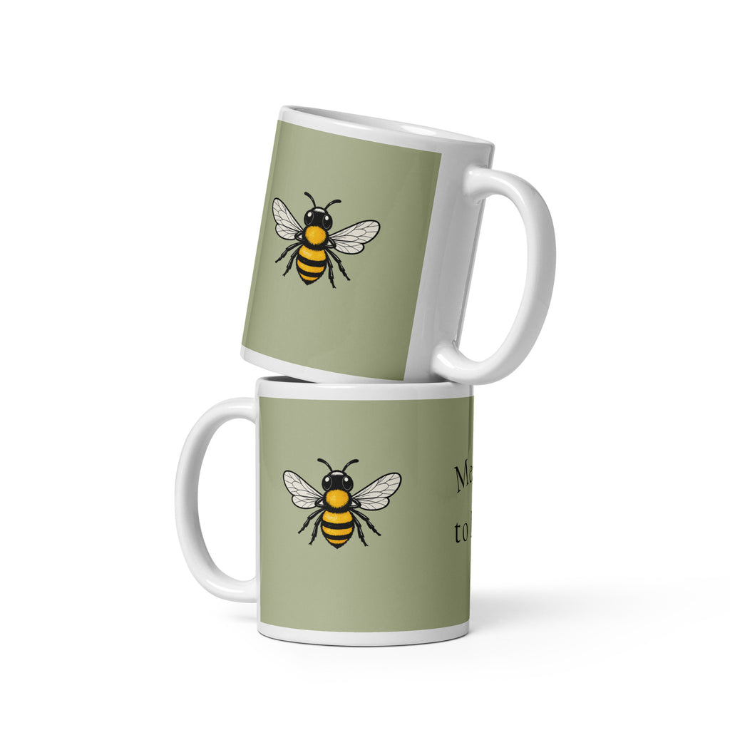 Sage green ceramic coffee mug set, white handle, black-and-yellow bee illustration