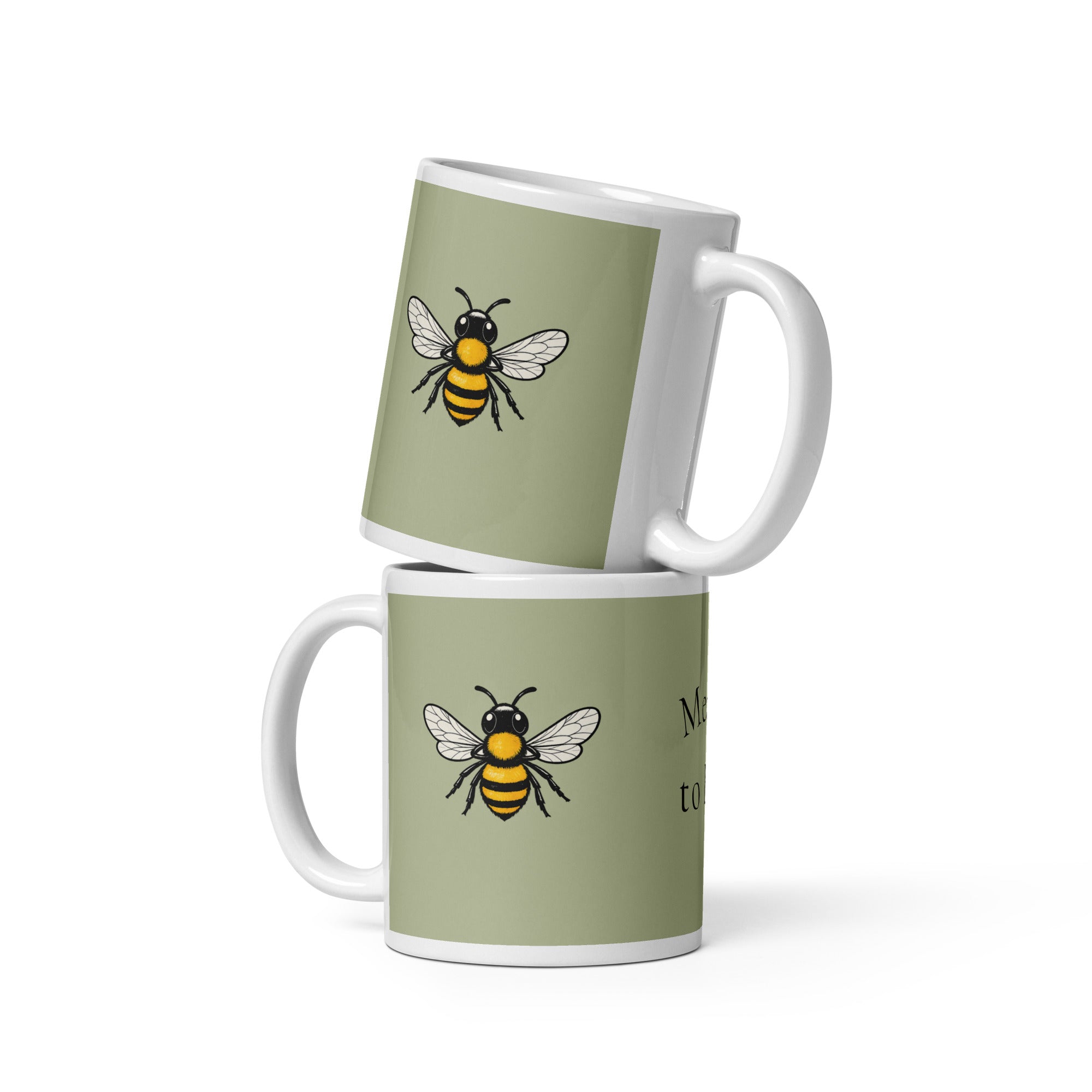 Sage green ceramic coffee mug set, white handle, black-and-yellow bee illustration