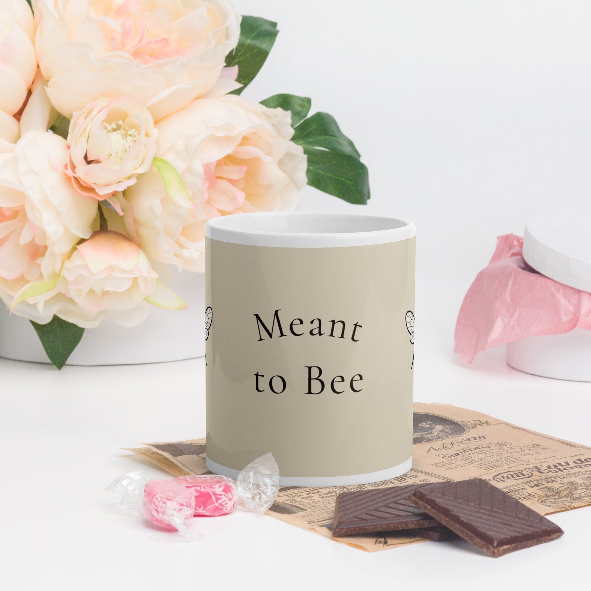 Light beige ceramic mug with 'Meant to Bee' text and white handle