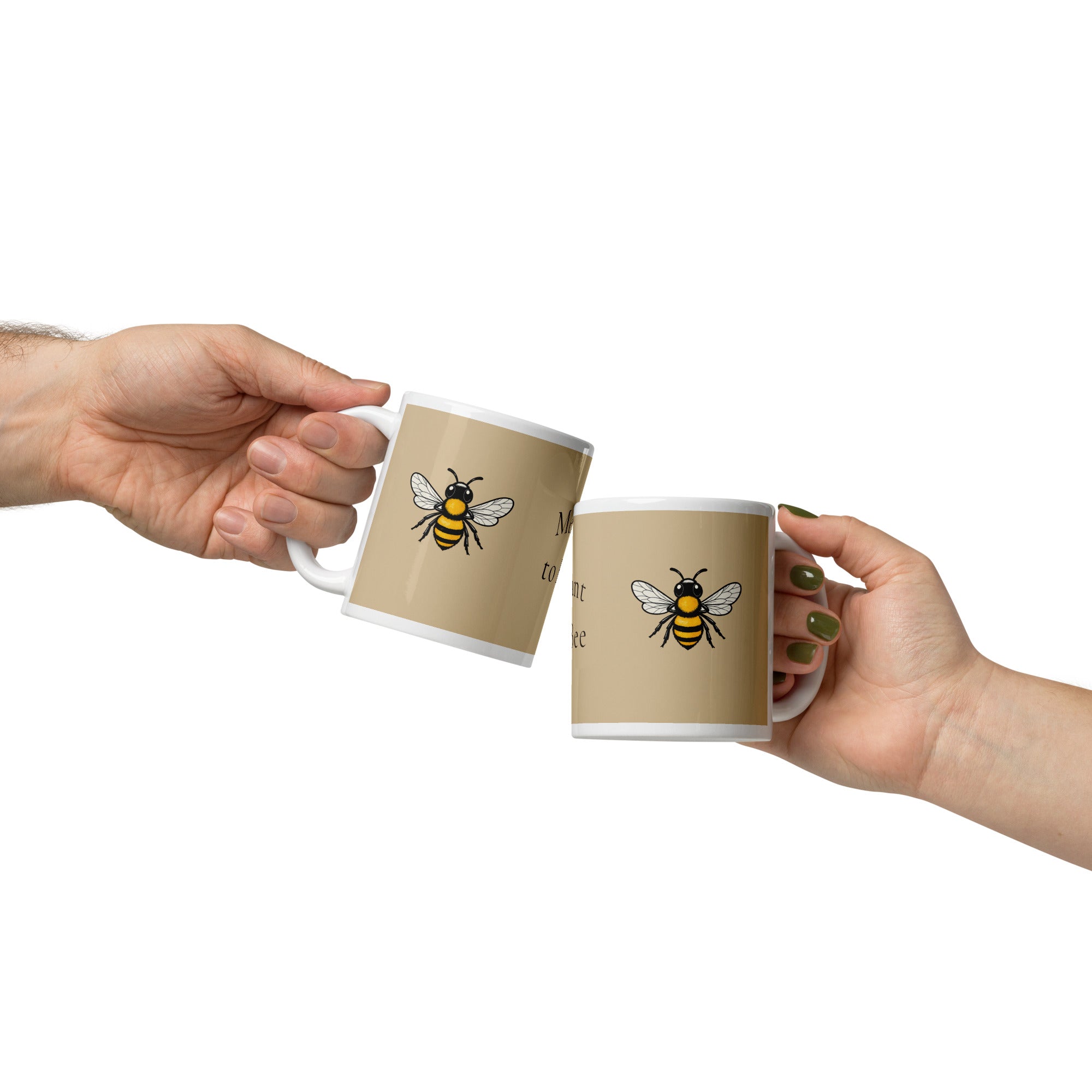 Two hands holding beige ceramic mugs with white rims, each with a yellow-and-black bee