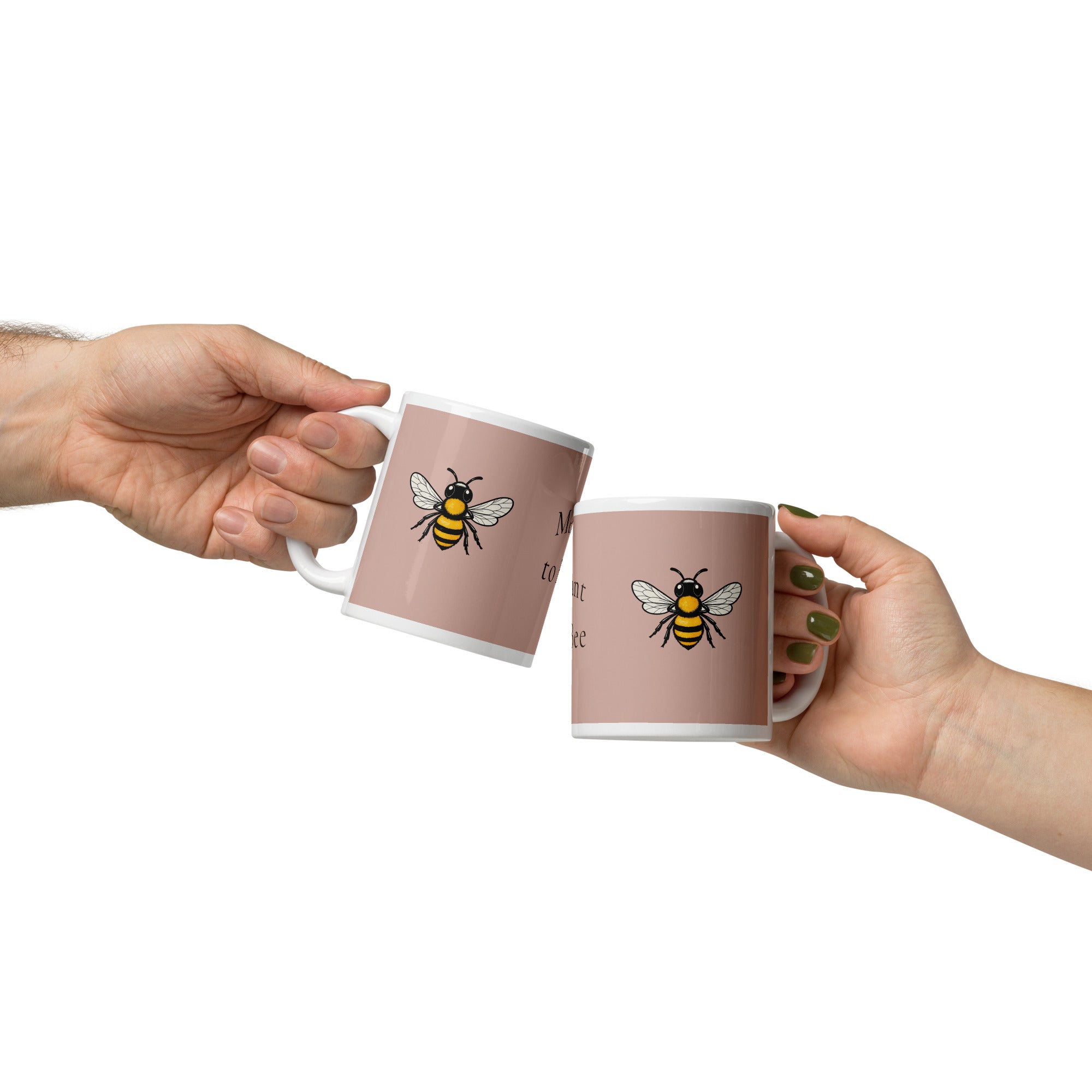 Pair of dusty rose ceramic mugs with bee illustrations and white interiors