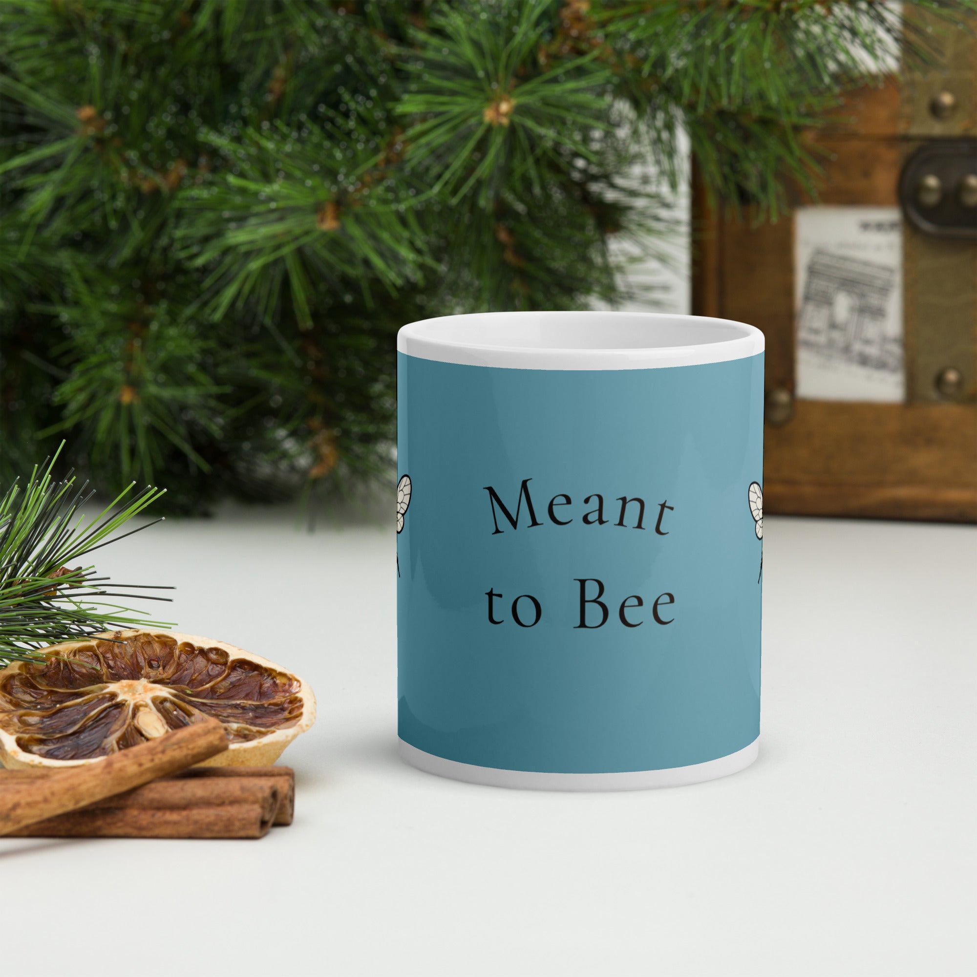 Blue ceramic mug with “Meant to Bee” text design in dark lettering