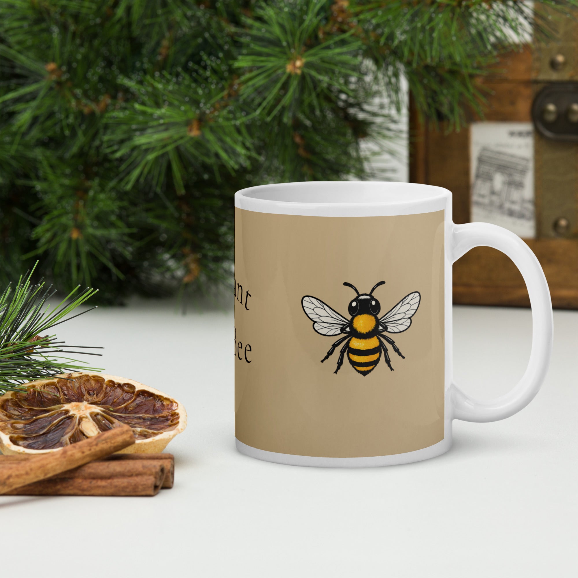 Beige ceramic coffee mug with bee illustration and white handle