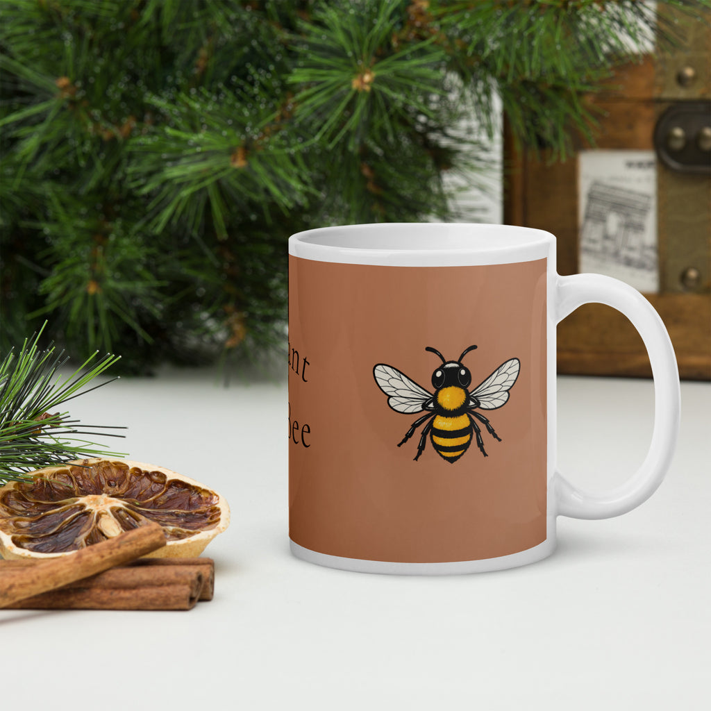 Brown ceramic mug with bee graphic on front, white handle visible