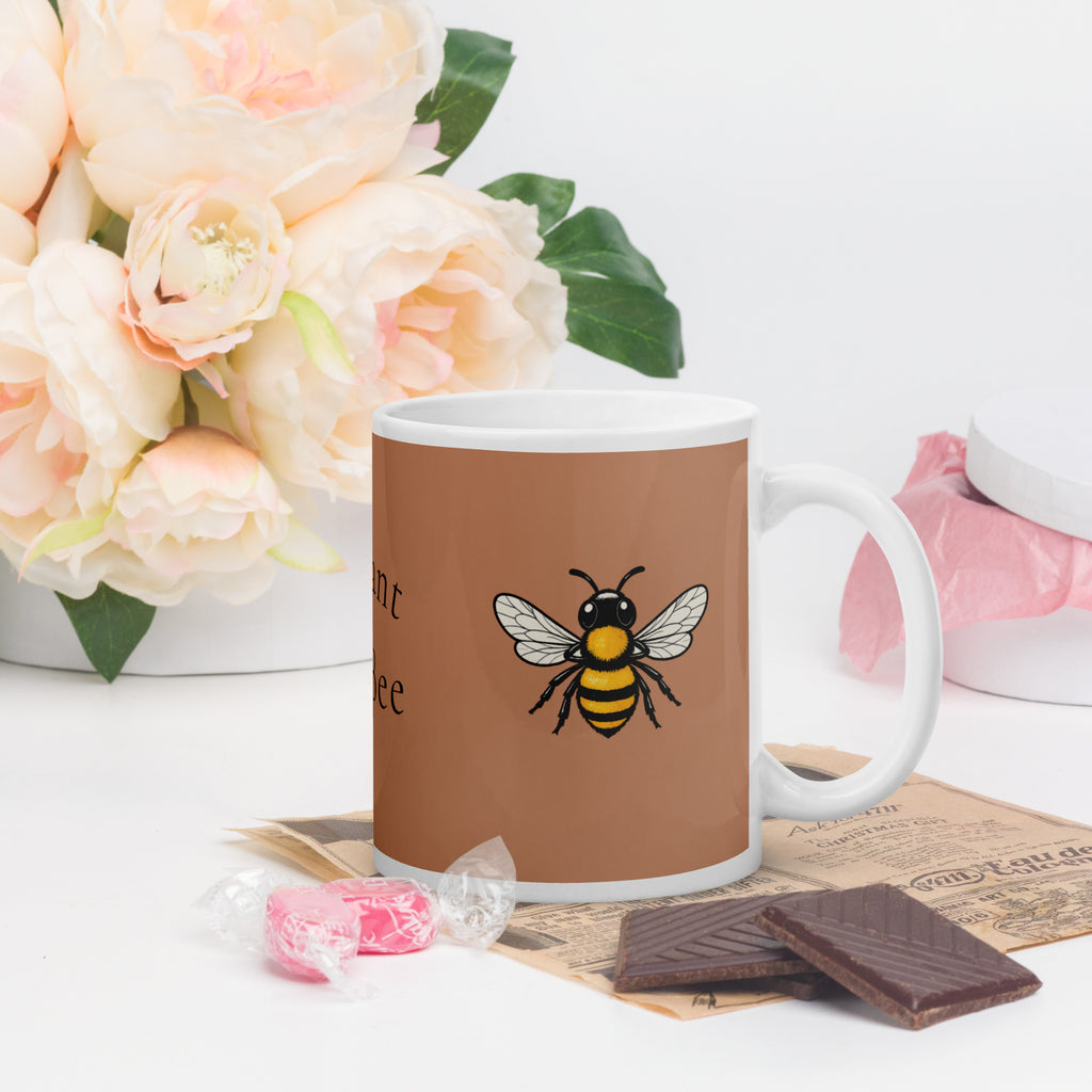 Brown ceramic mug with bee illustration, white handle and rim