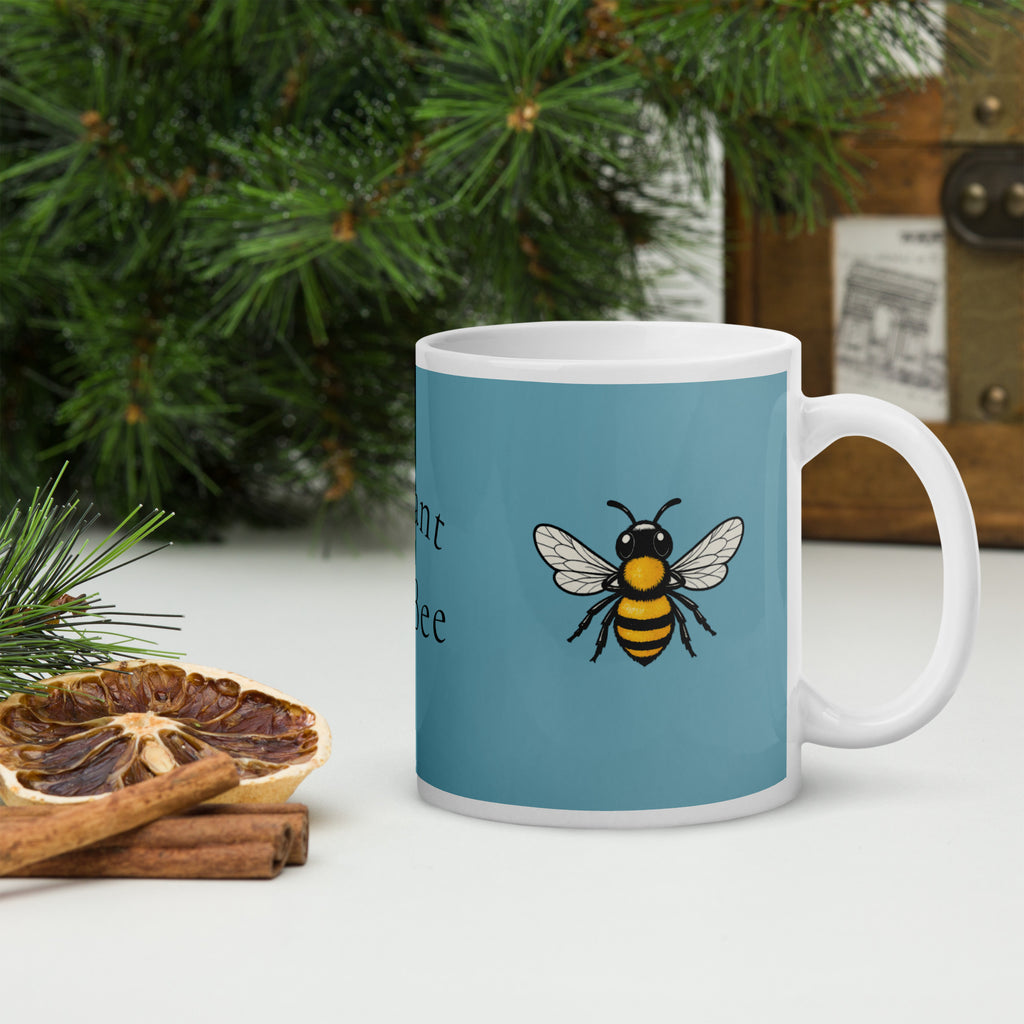 Blue ceramic mug with bee illustration and white rim, front view