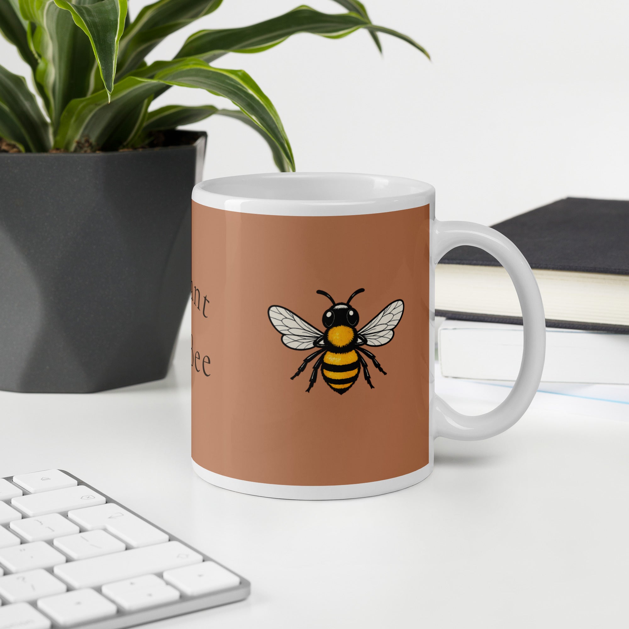 Brown ceramic mug with bee illustration and white handle; side view
