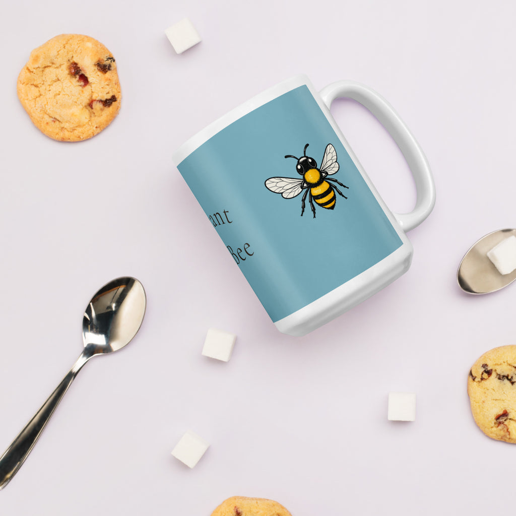 Blue ceramic mug with bee illustration, white handle and rim