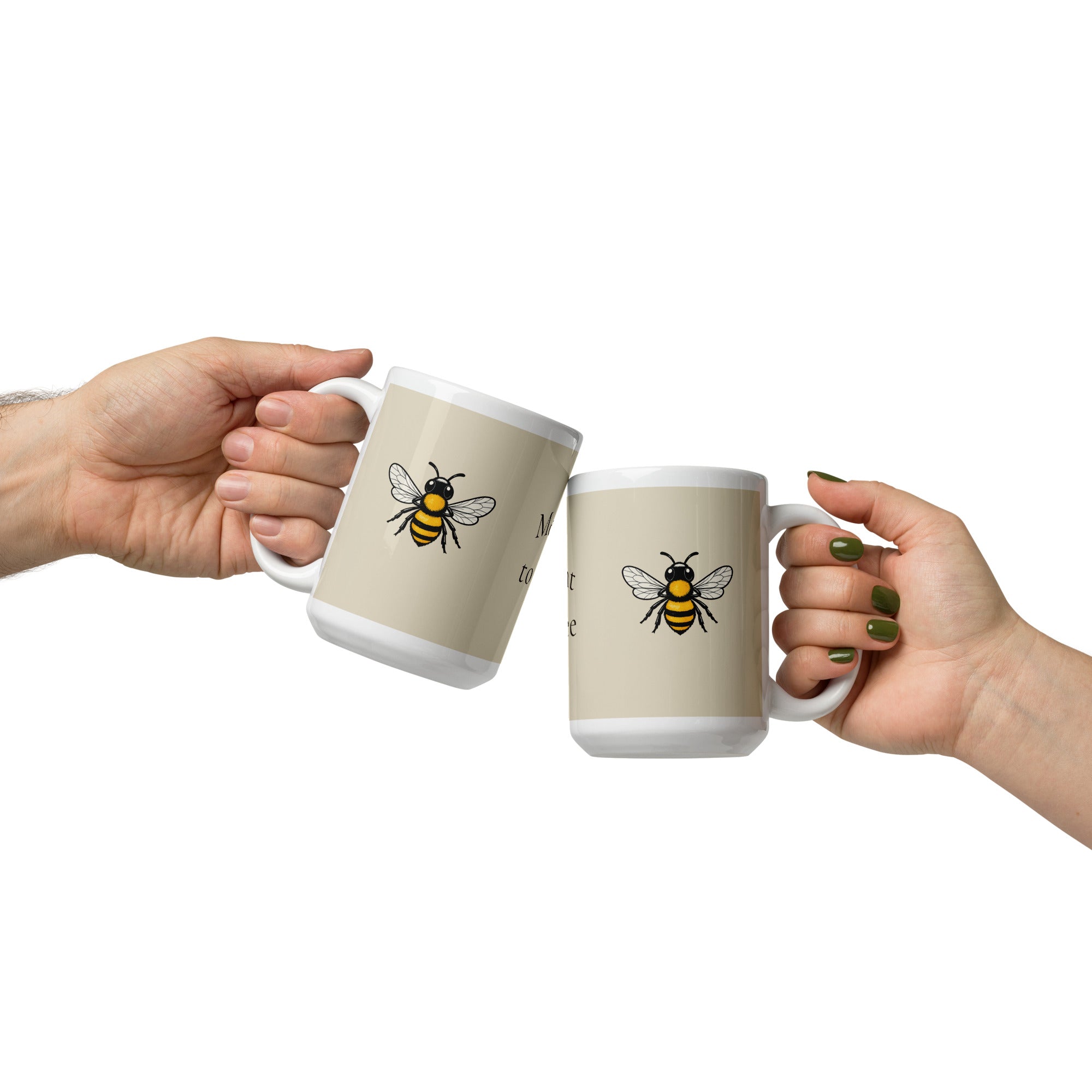 Light beige ceramic mug with bee graphic, held in hands
