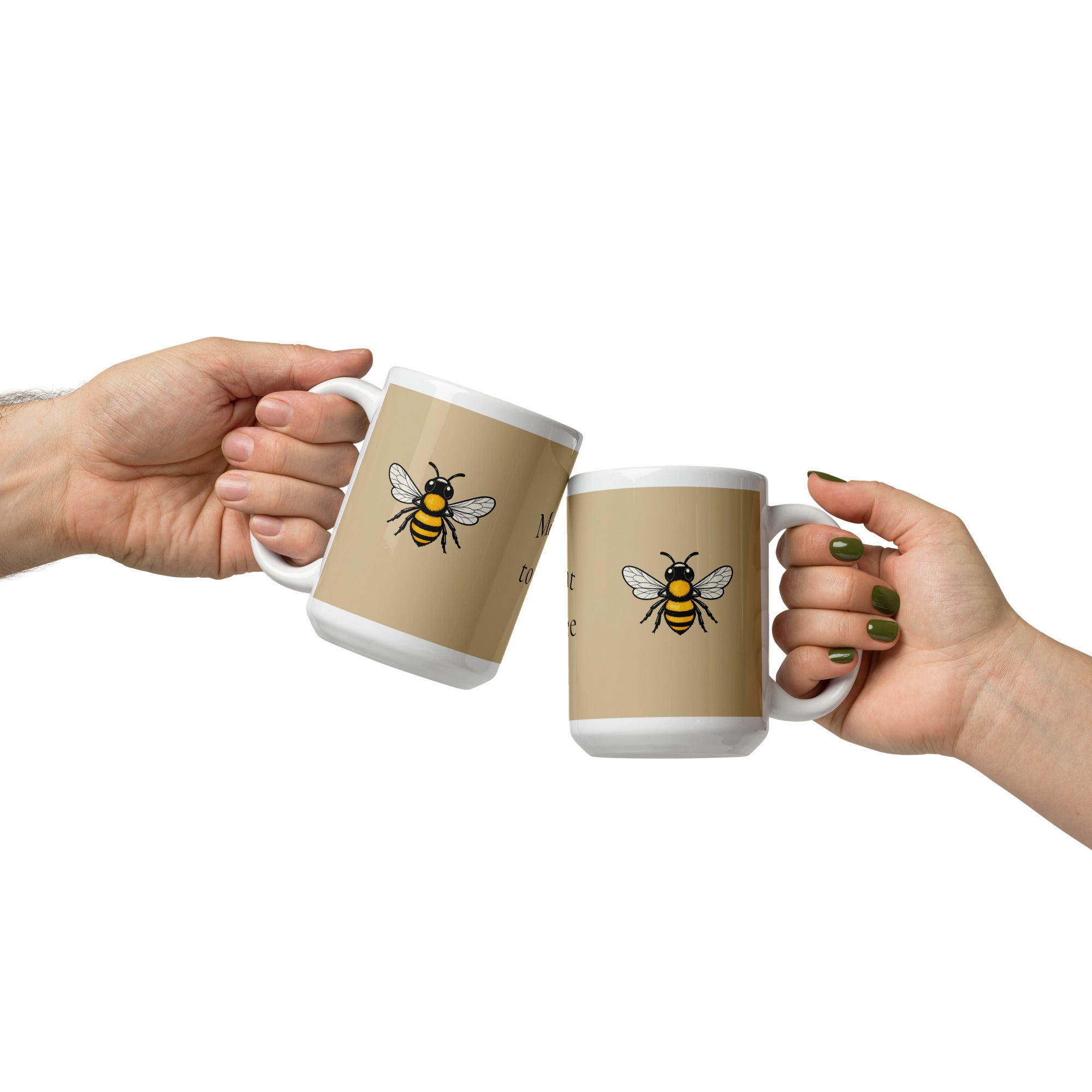 Two beige ceramic mugs with white rims held by two people, bee illustrations facing outward