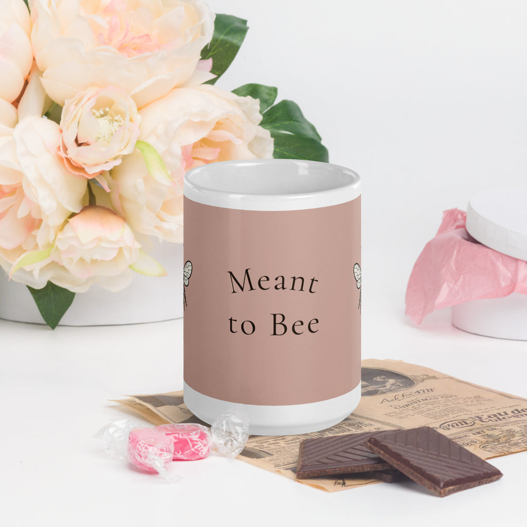 Dusty rose ceramic coffee mug with “Meant to Bee” text centered on front.