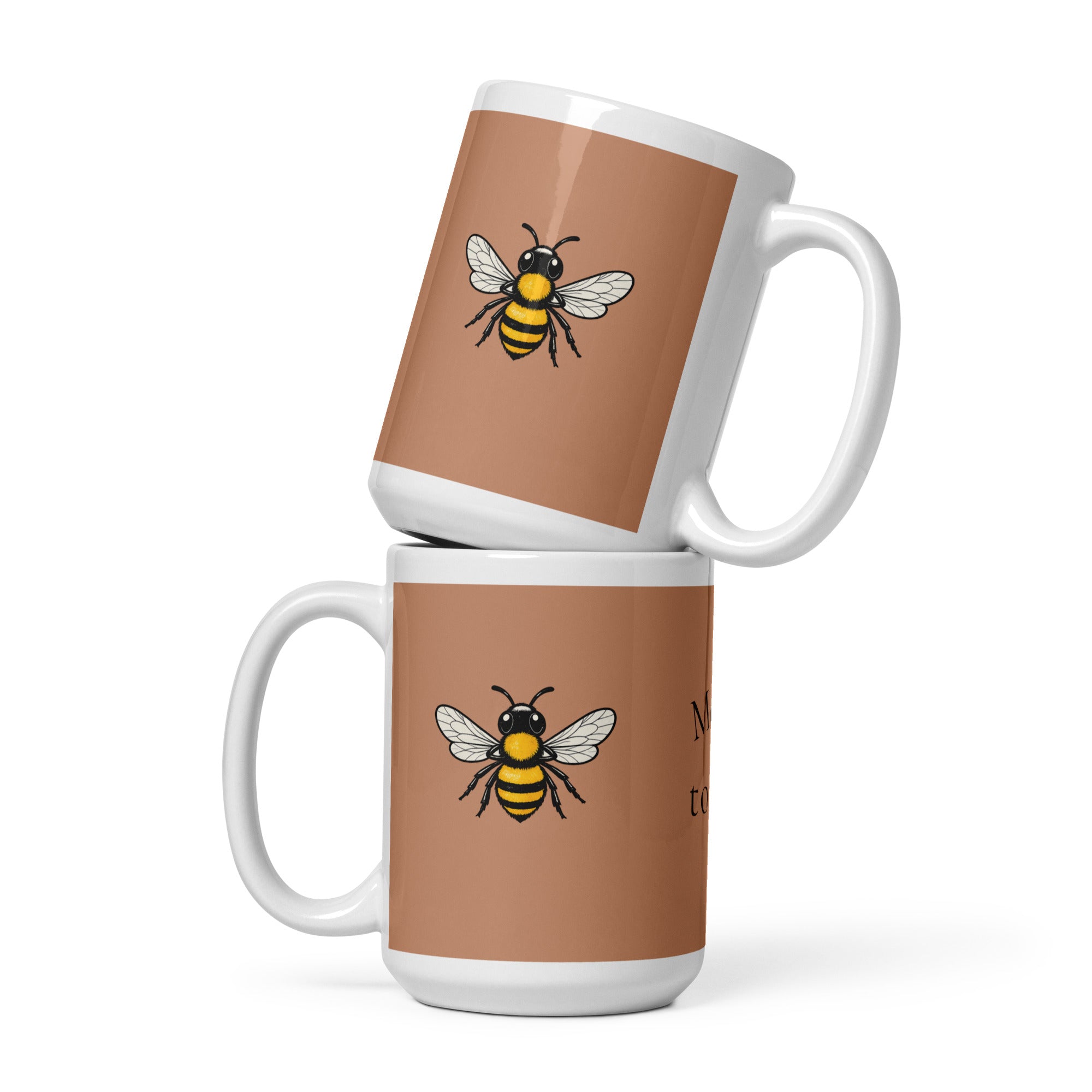 Brown ceramic mug with white handle and bee illustration on front