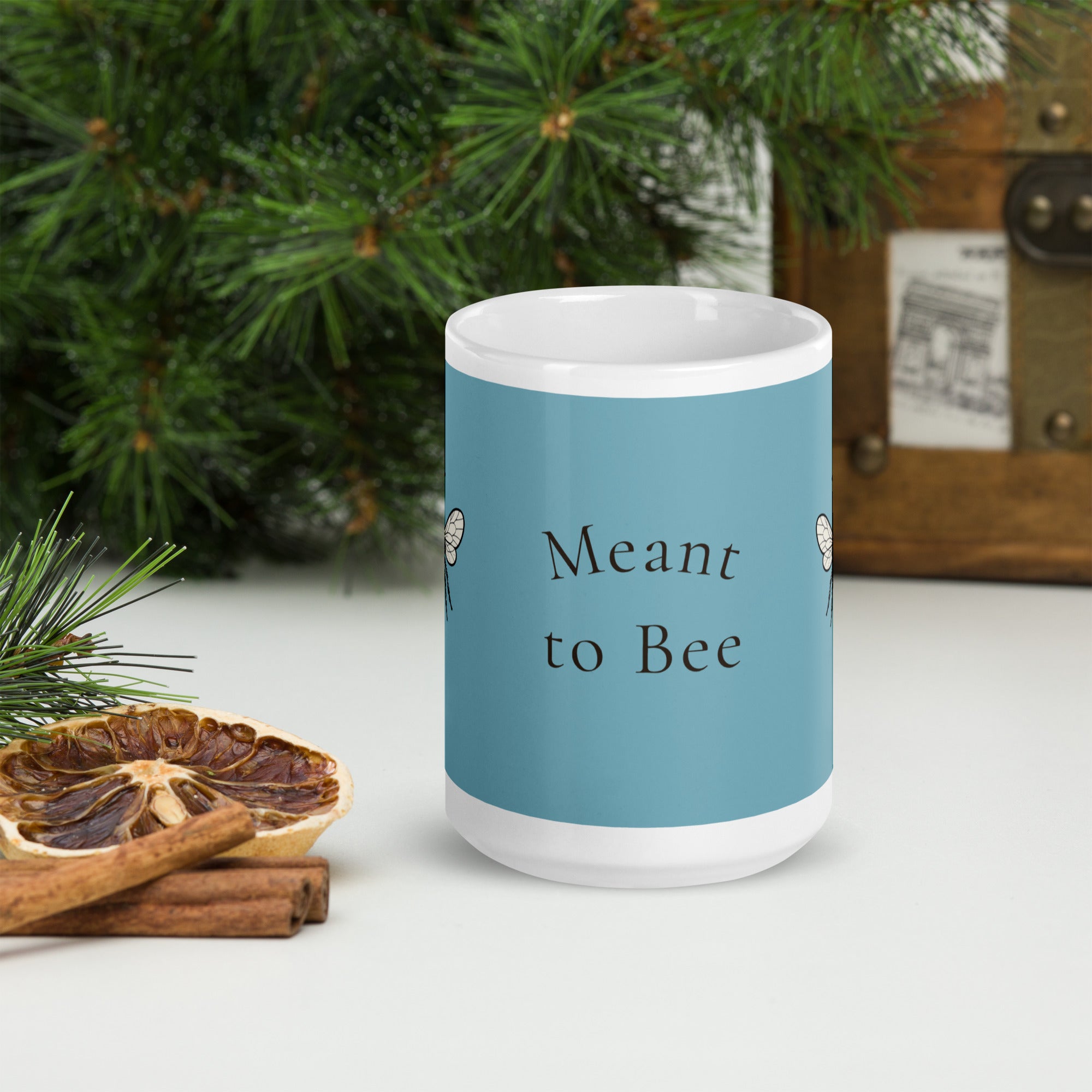 Blue ceramic mug with “Meant to Bee” text on the front