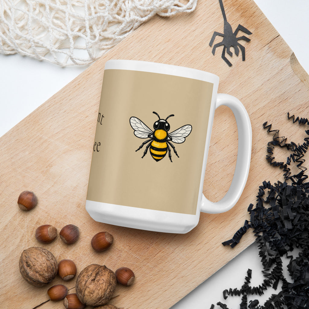 Beige ceramic mug with bee illustration, white rim and handle