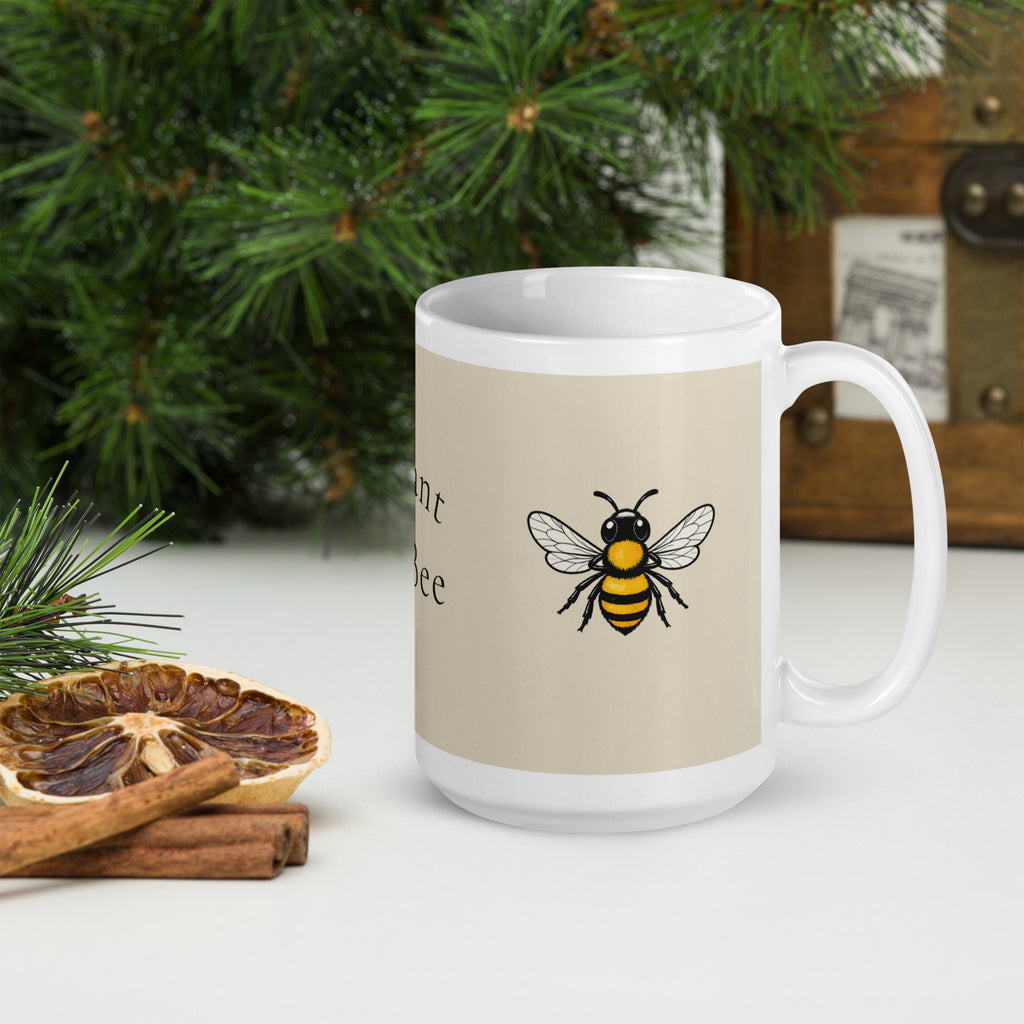 Light beige ceramic mug with bee illustration, white rim, and curved handle