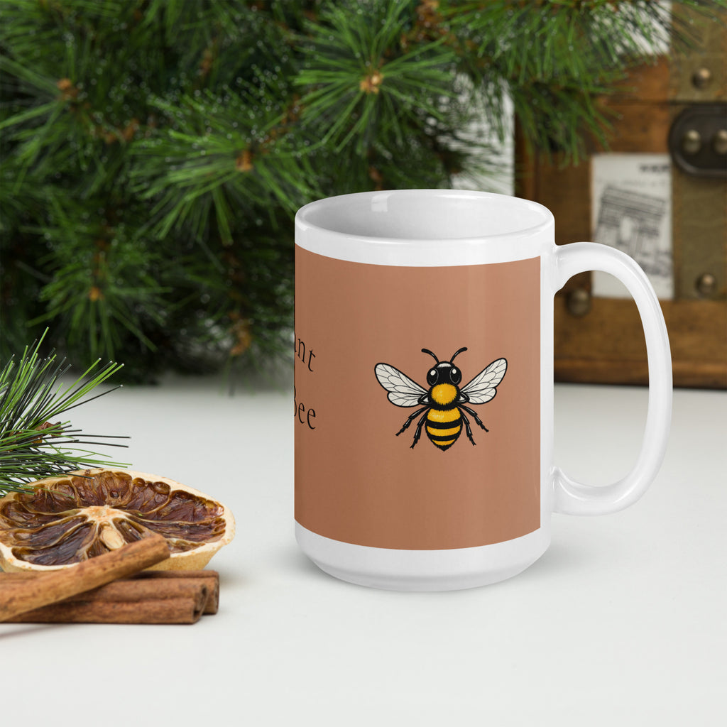 Brown ceramic mug with "Meant to Bee" text and white handle