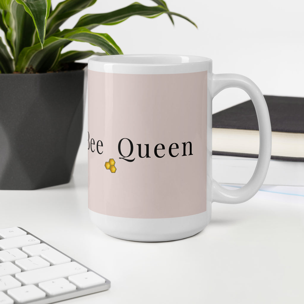 Pink ceramic mug with 'Bee Queen' and bee logo, white handle