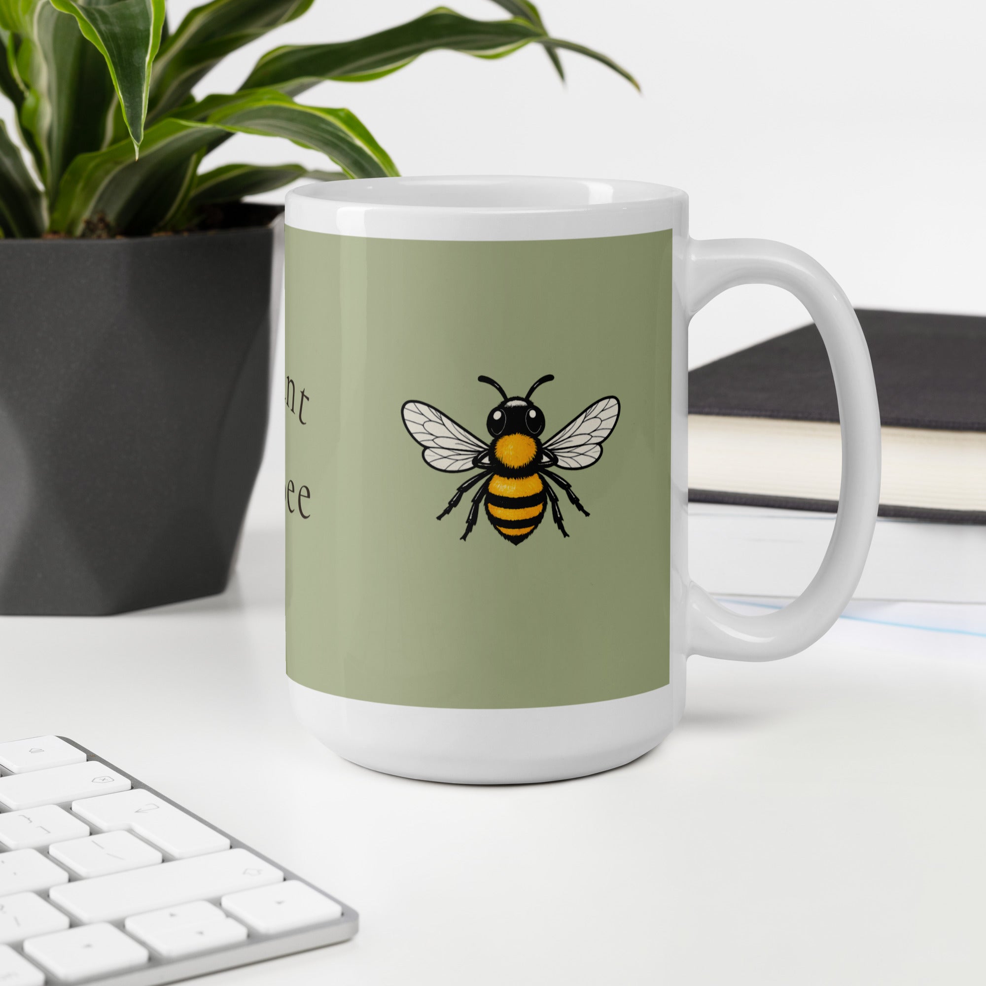 Sage green ceramic coffee mug with bee illustration, front view with handle