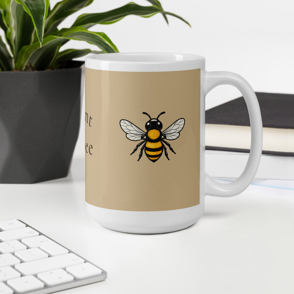 Beige ceramic coffee mug with centered bee illustration and white rim
