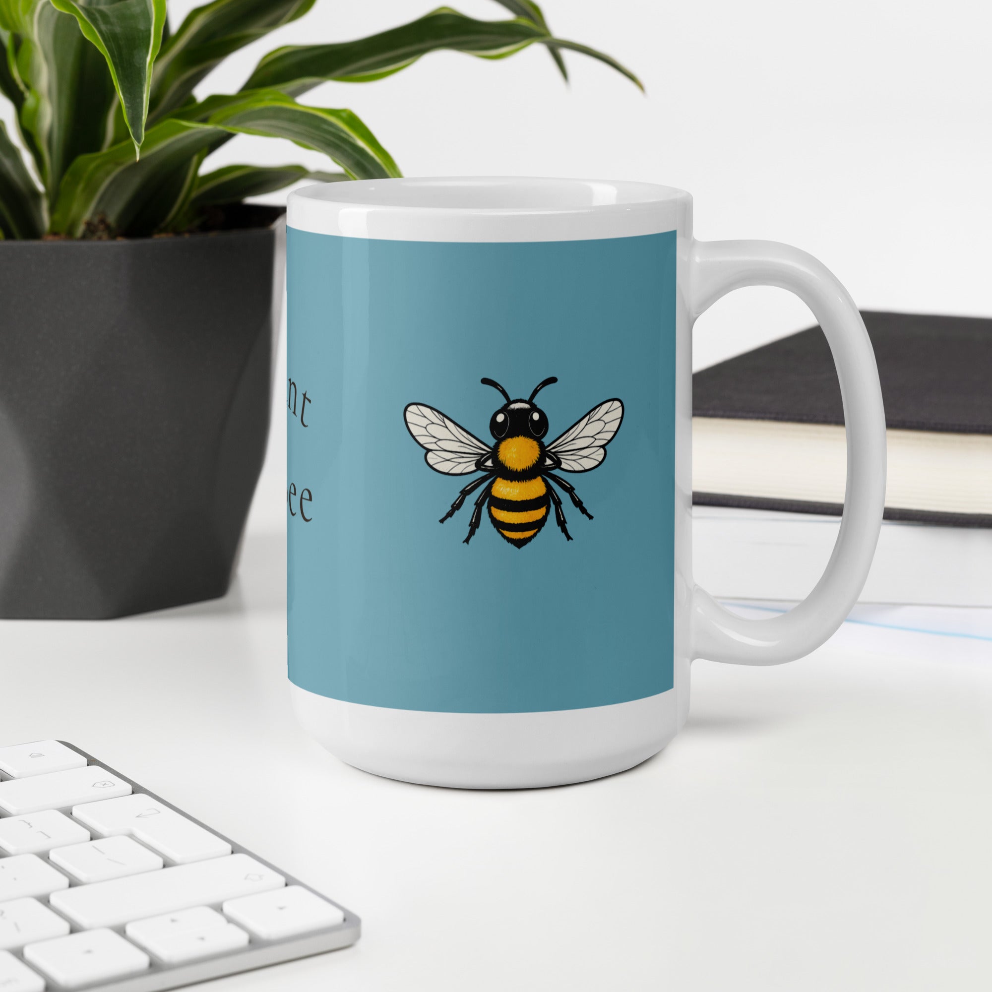 Blue ceramic coffee mug with bee illustration, white handle and rim