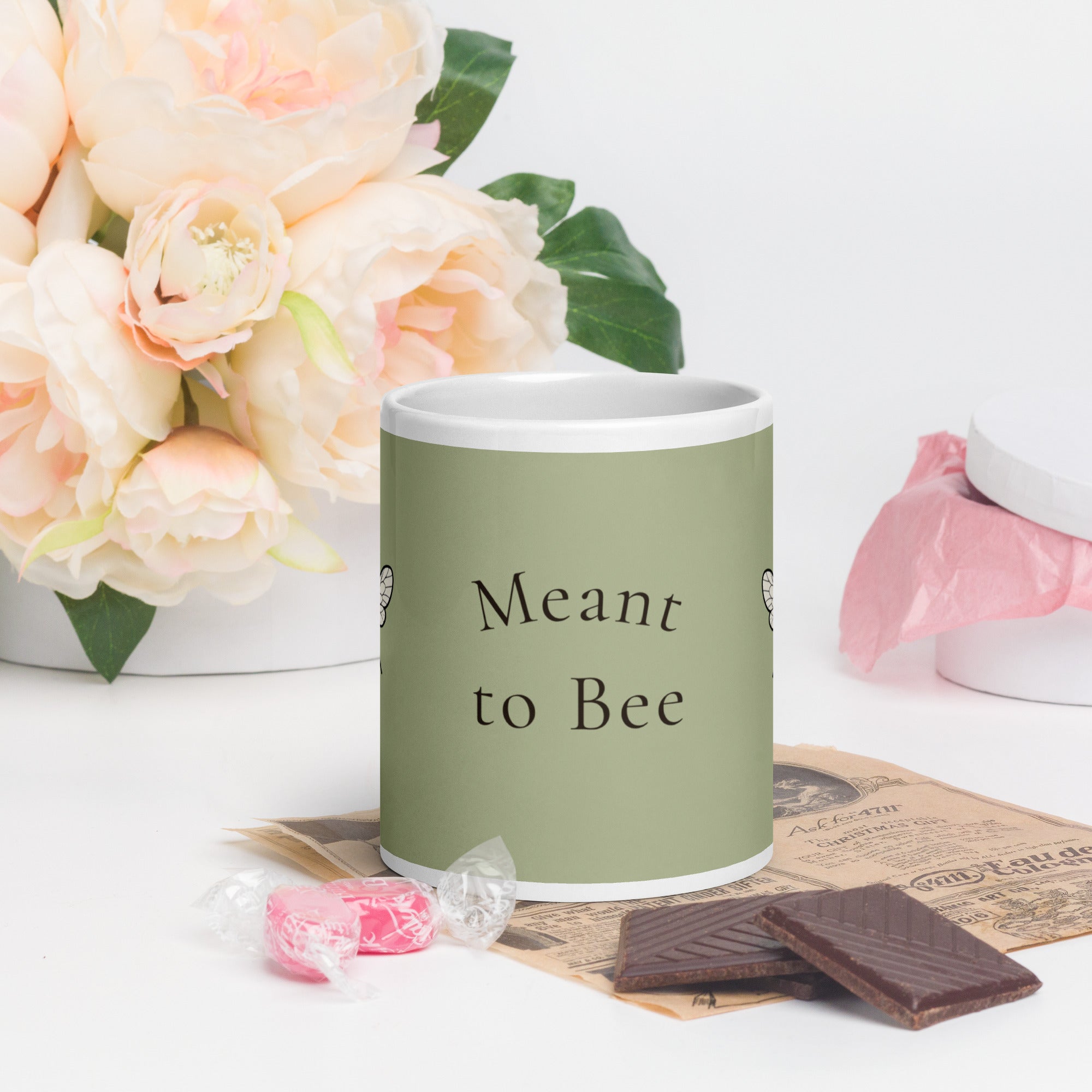 Sage green ceramic coffee mug, white rim, 'Meant to Bee' text and bee illustration