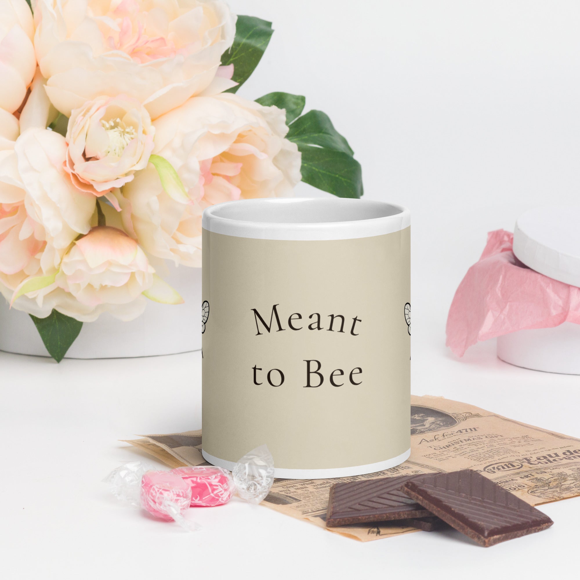 Light beige ceramic mug with bee graphic and “Meant to Bee” text on front