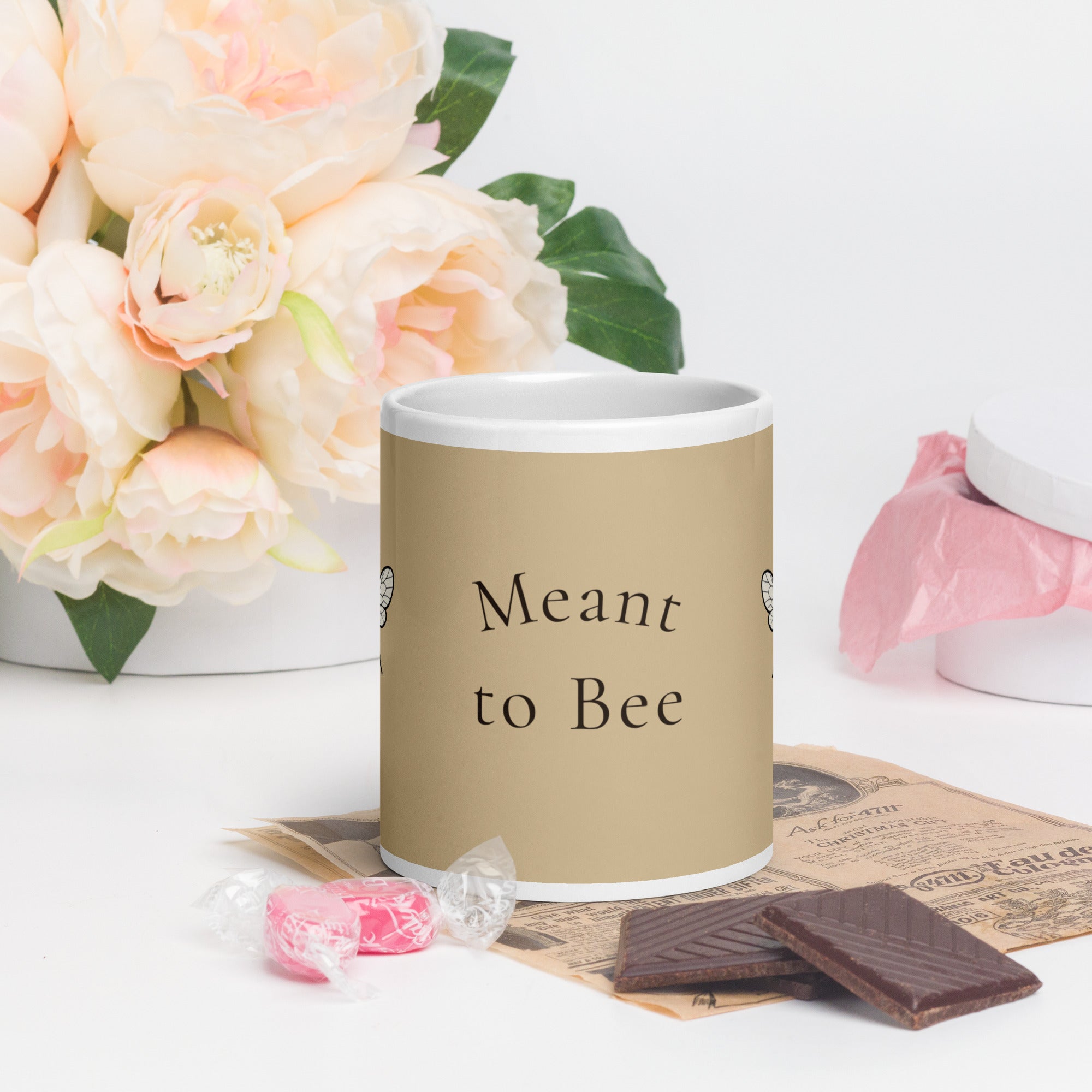 Beige ceramic coffee mug with 'Meant to Bee' text and a bee illustration